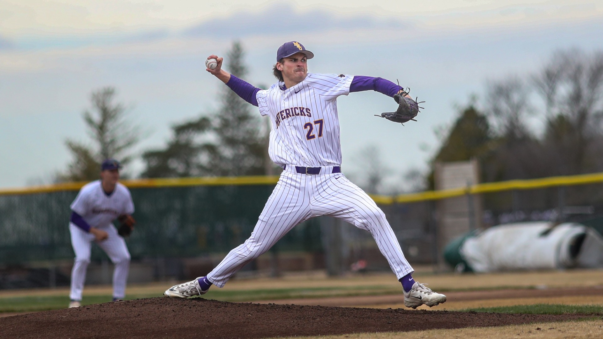Mack Crowley stepping up to throw a pitch vs Wayne State 