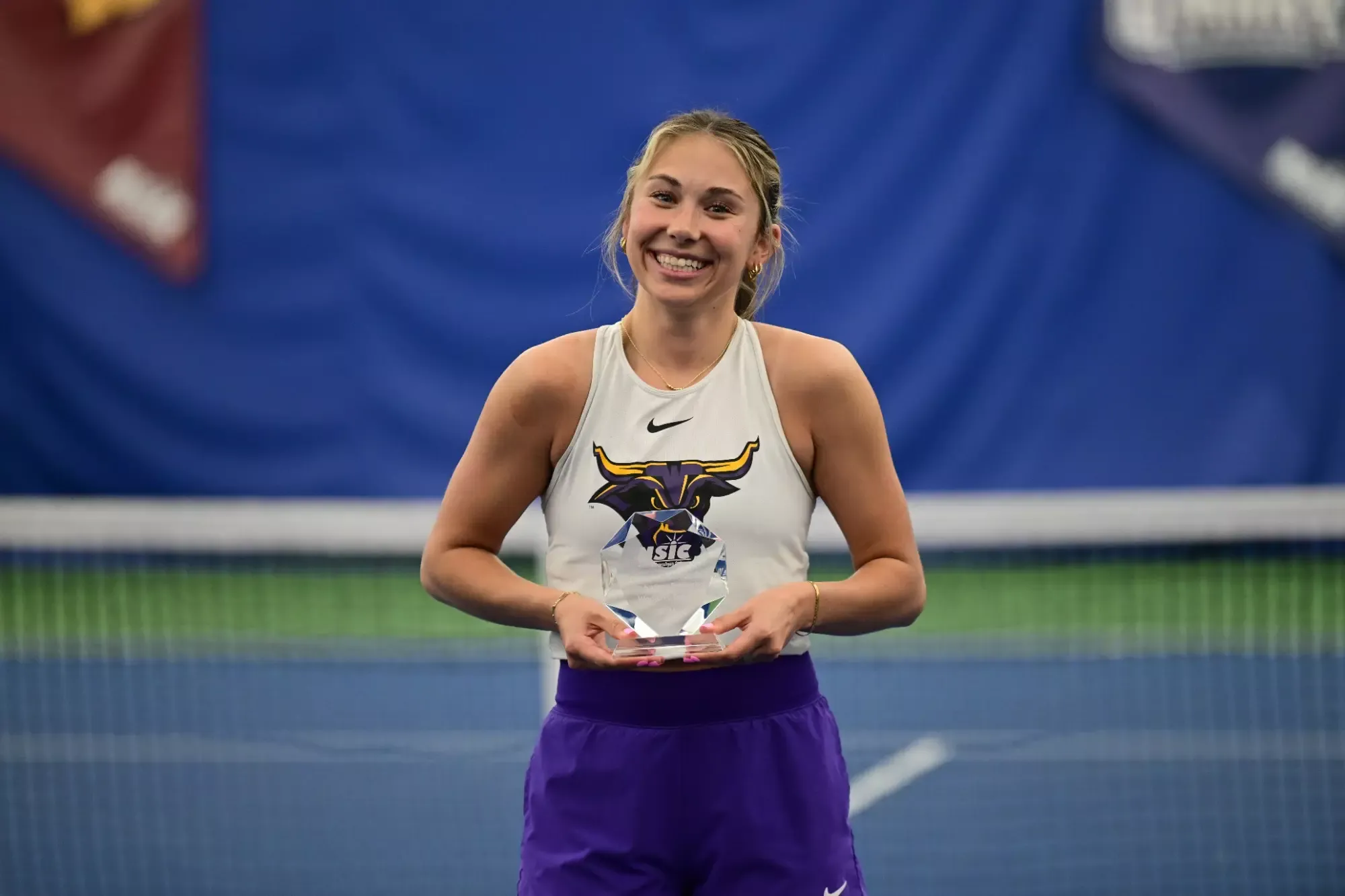 McKenna DeMarce with her NSIC Elite 18 Trophy