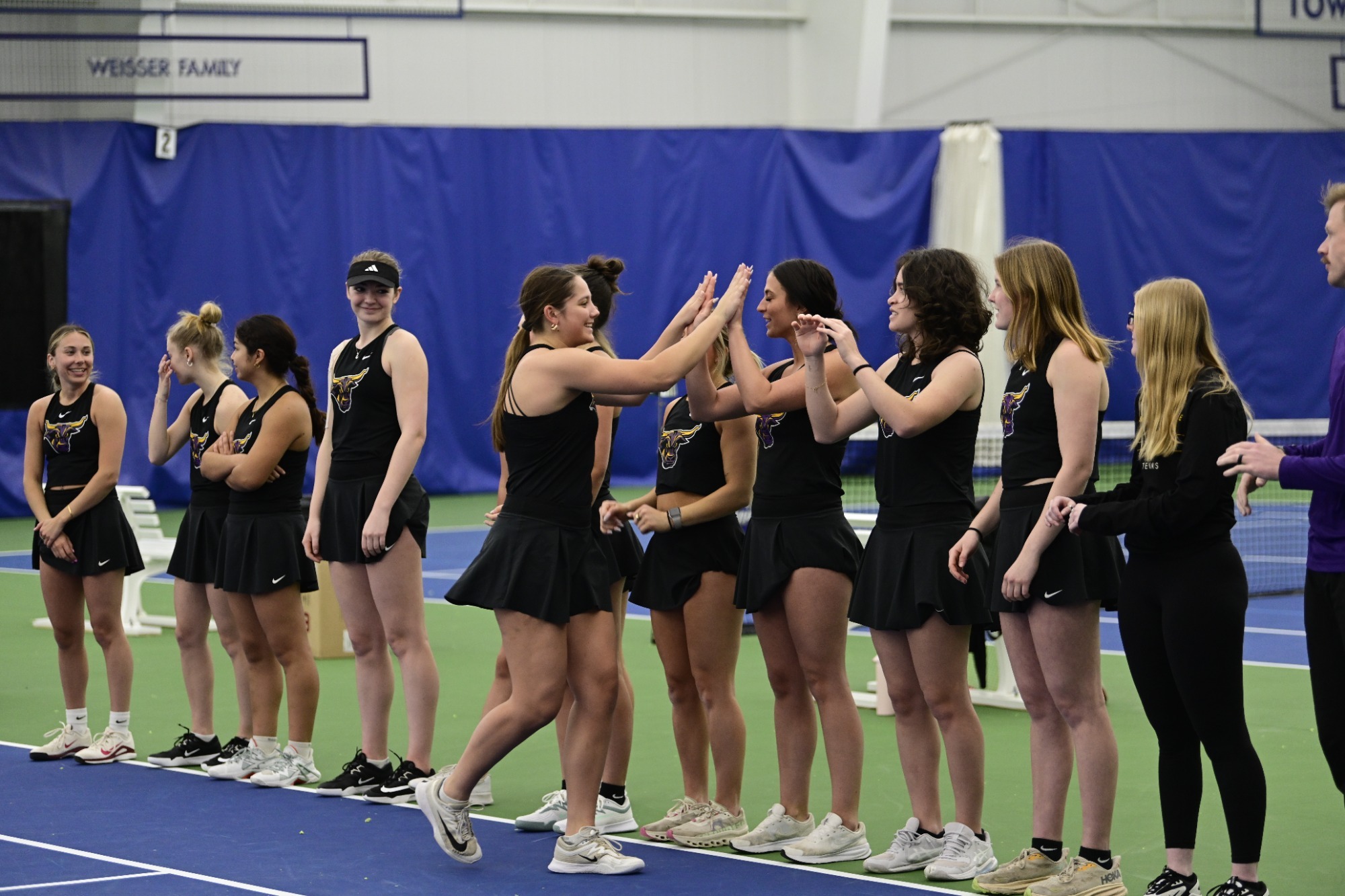 A photo of the Maverick Tennis Team before their dual against Augustana
