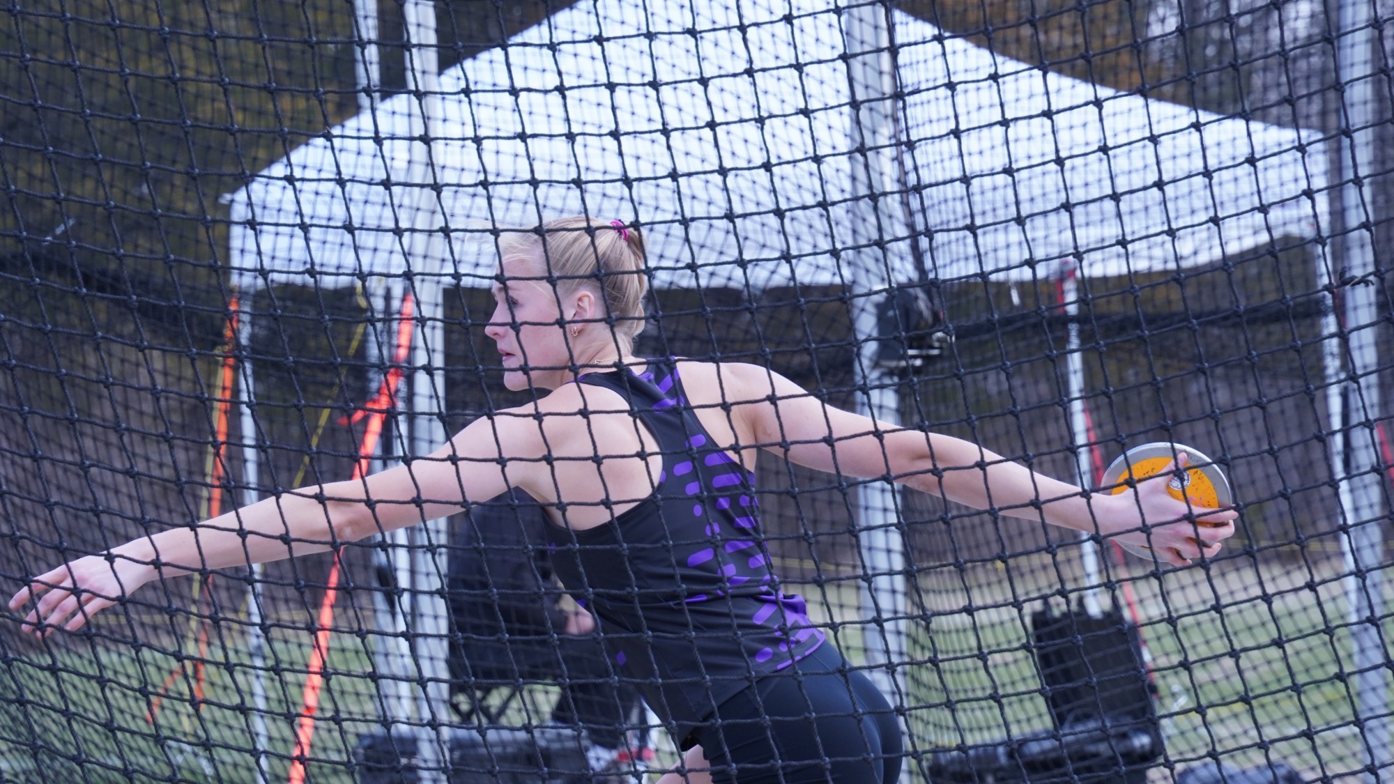 A photo of Elise Jensen competing in the discus