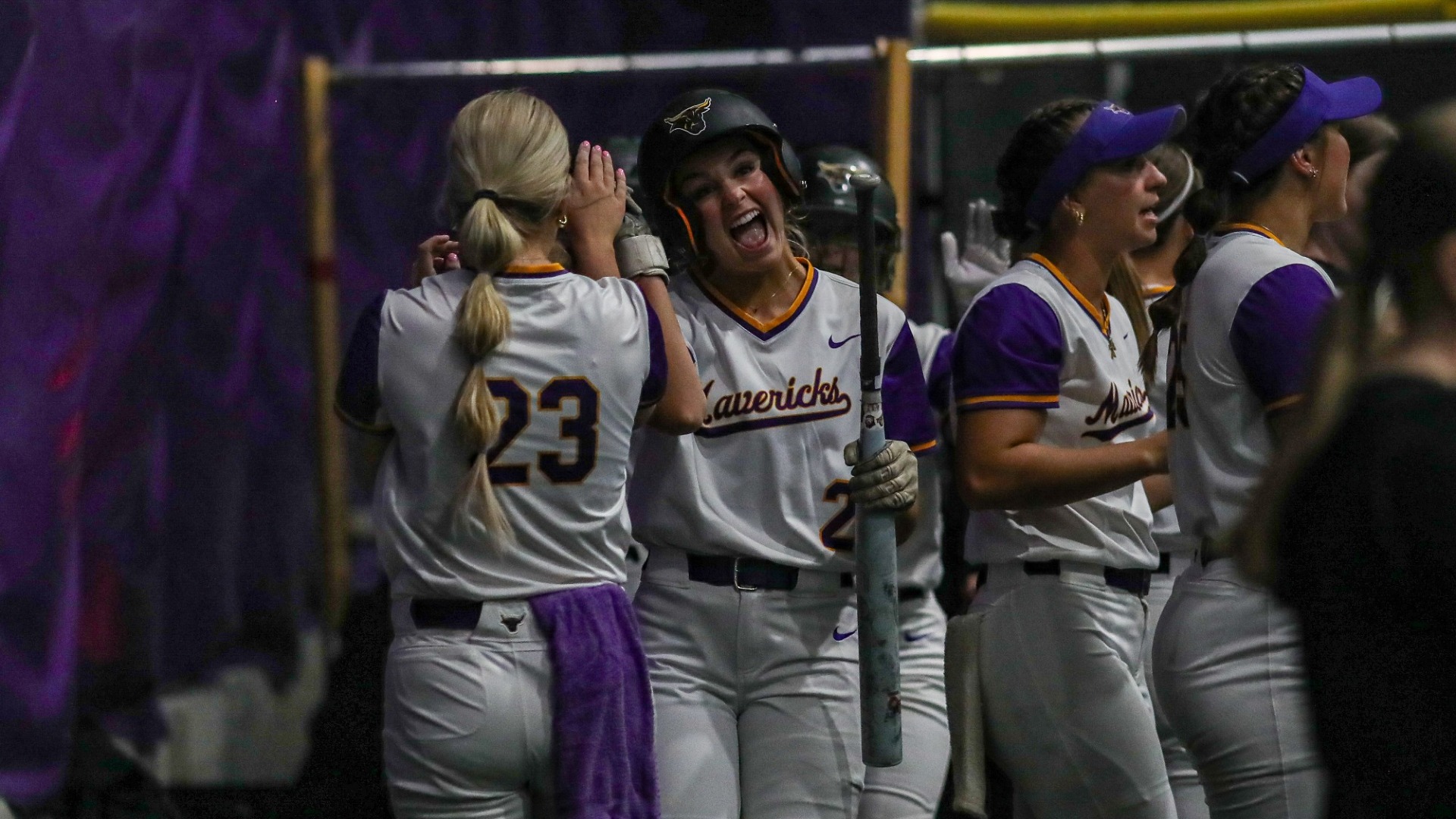 Broderick and Fry high five in the MSU dugout