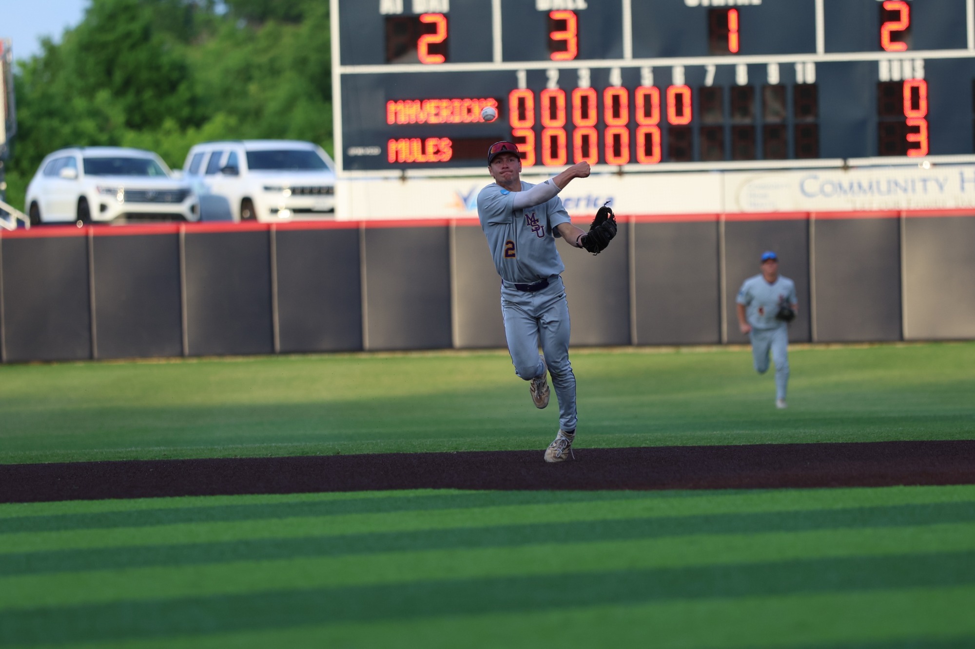 Jake Berkland throwing the baseball to first base vs. Central Missouri