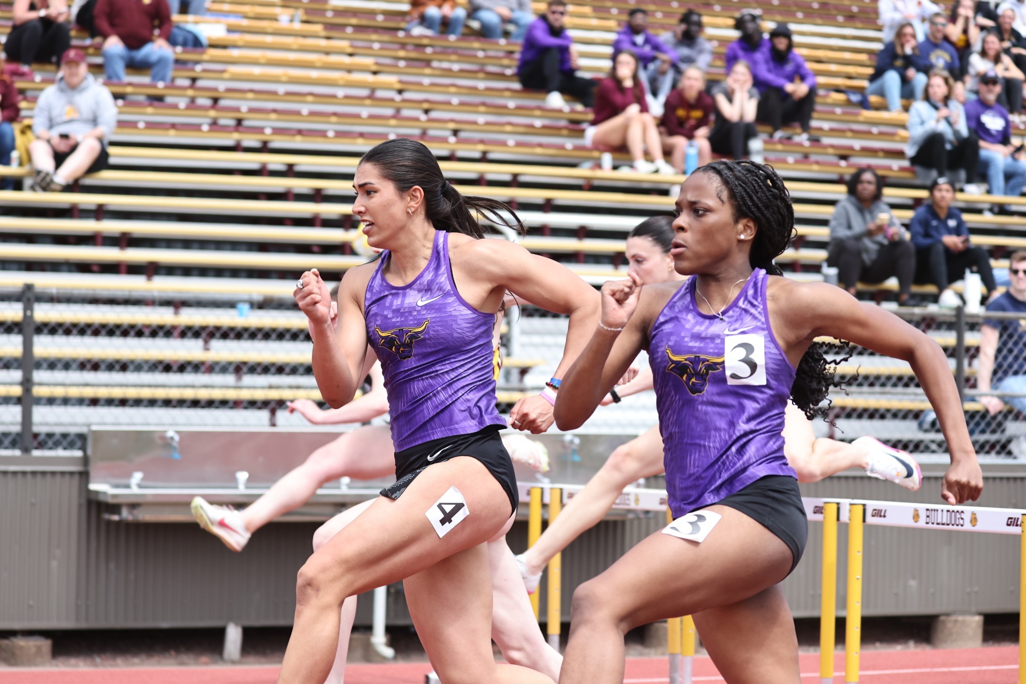 Miranda Lauvstad competing in the 100m hurdles at the NSIC Championships