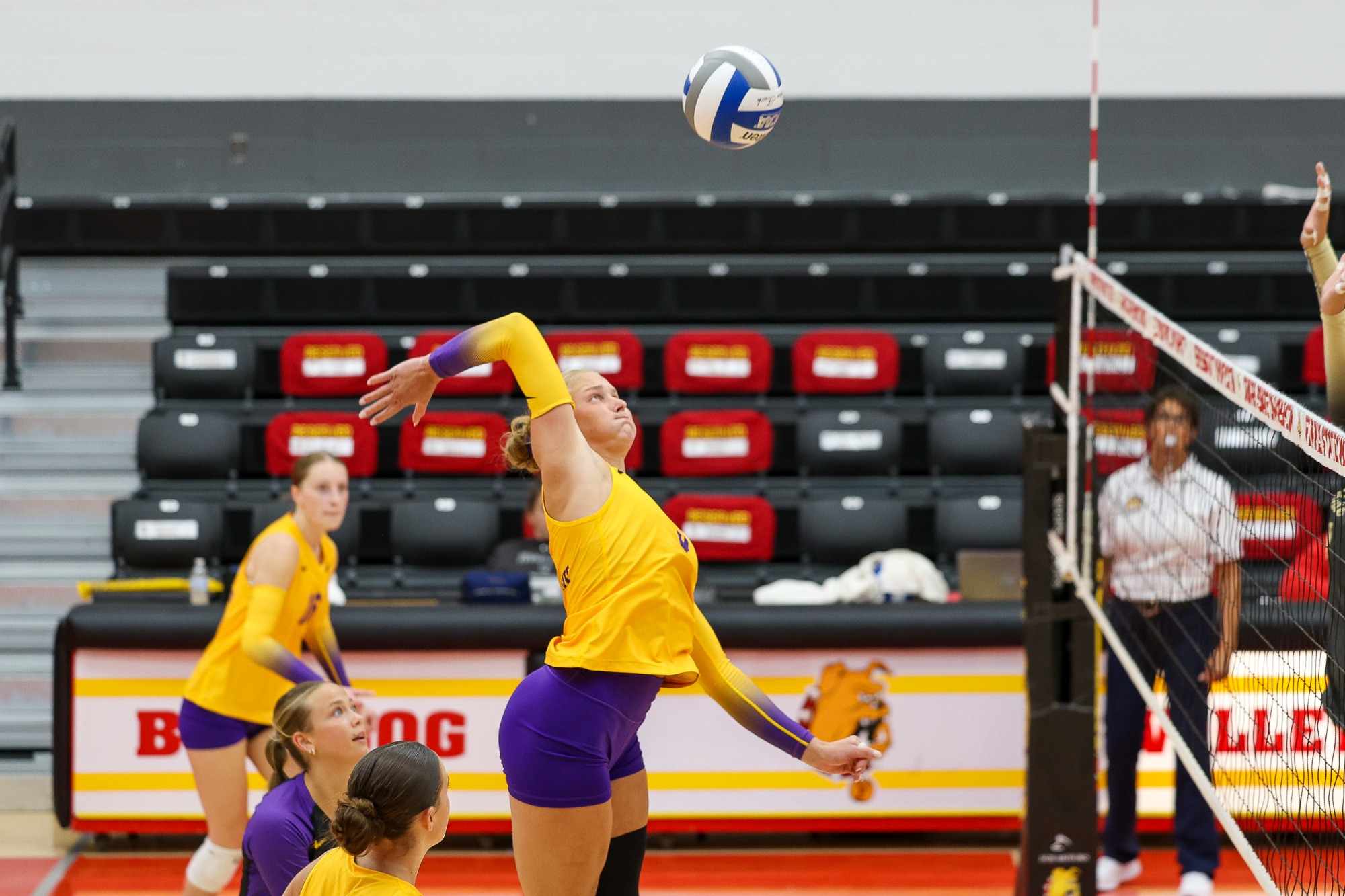 Olivia Sturgis attacking the volleyball
