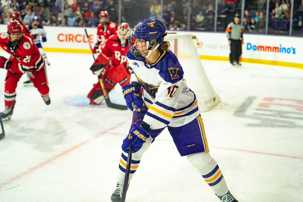 Zoe Lopez looks to pass the puck