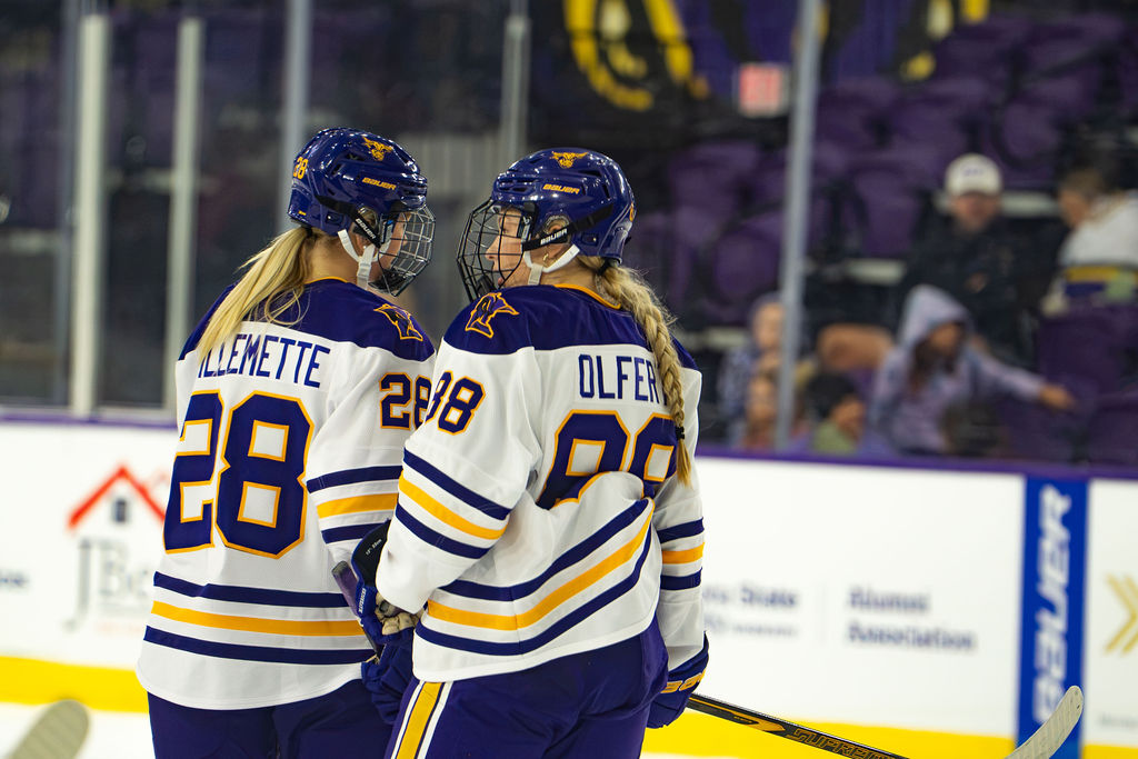 Ava Guillemette and Katie Olfert talking during a stoppage