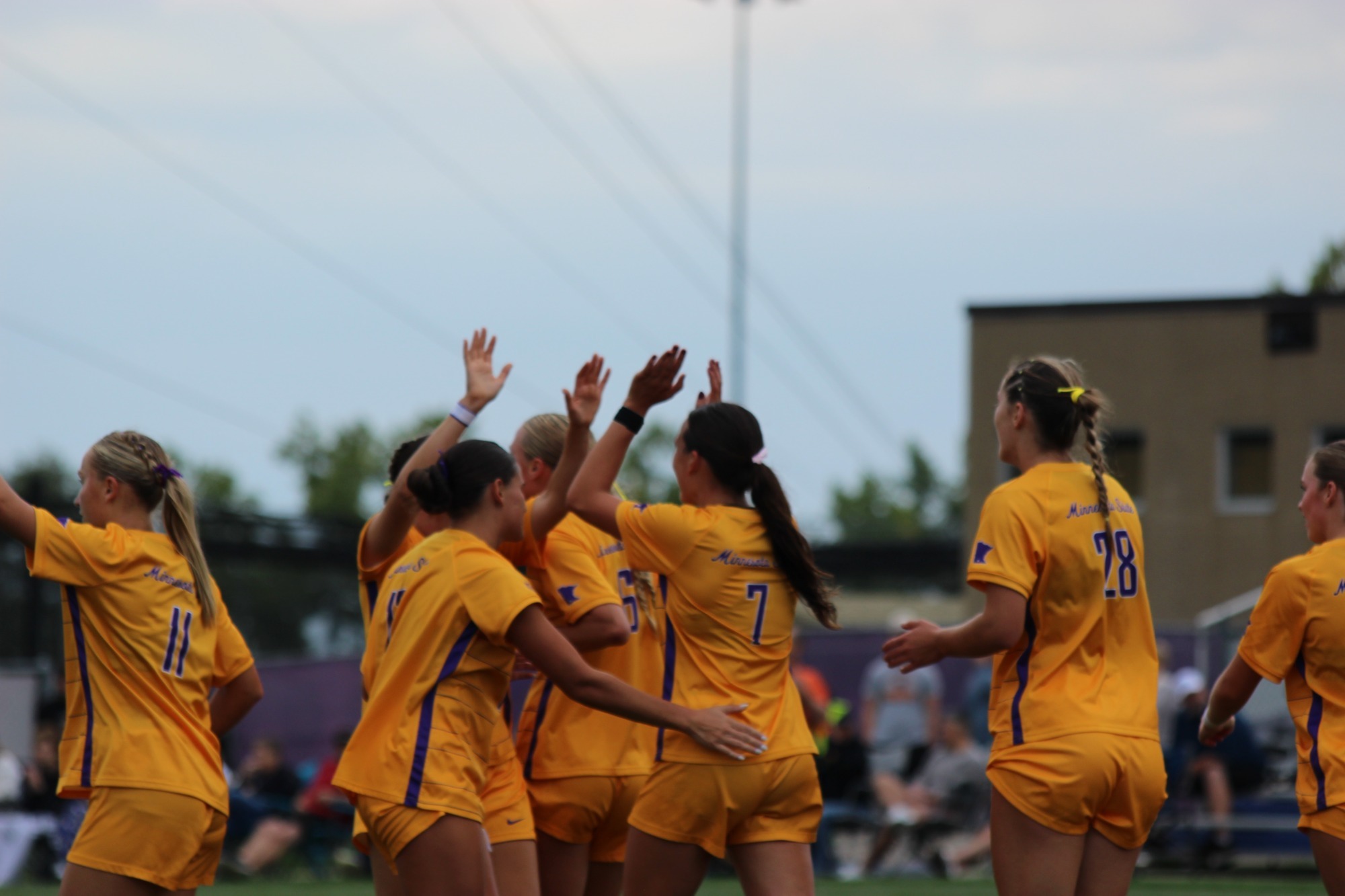 Amara Smith celebrates a goal with her team