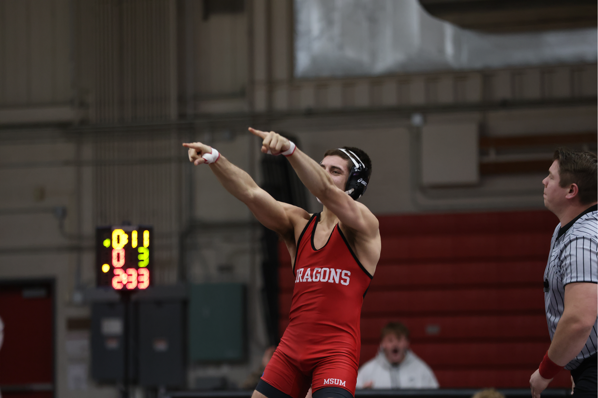 Parker Benz celebrates following a 26-second pin against Concordia College