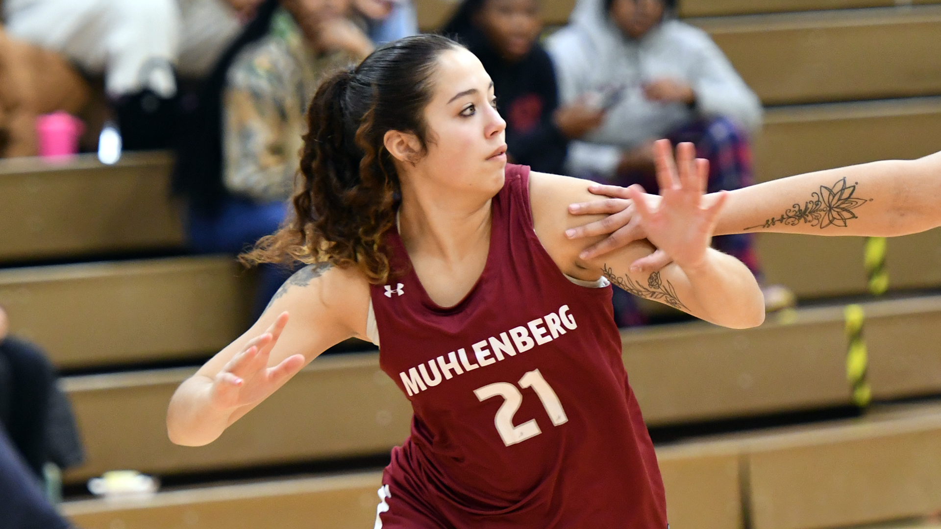 a basketball player in a red jersey running on the court