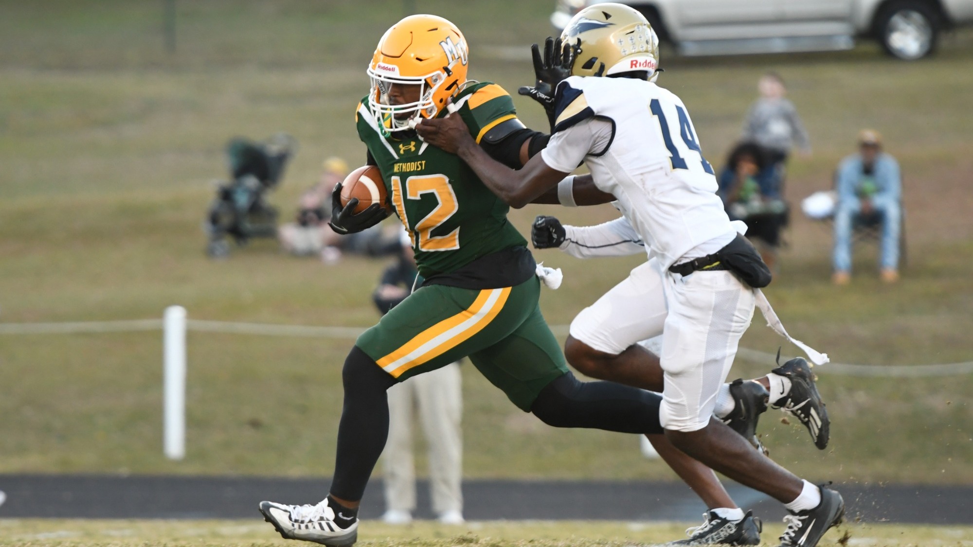 CJ Ferguson stiff arming a N.C. Wesleyan defender
