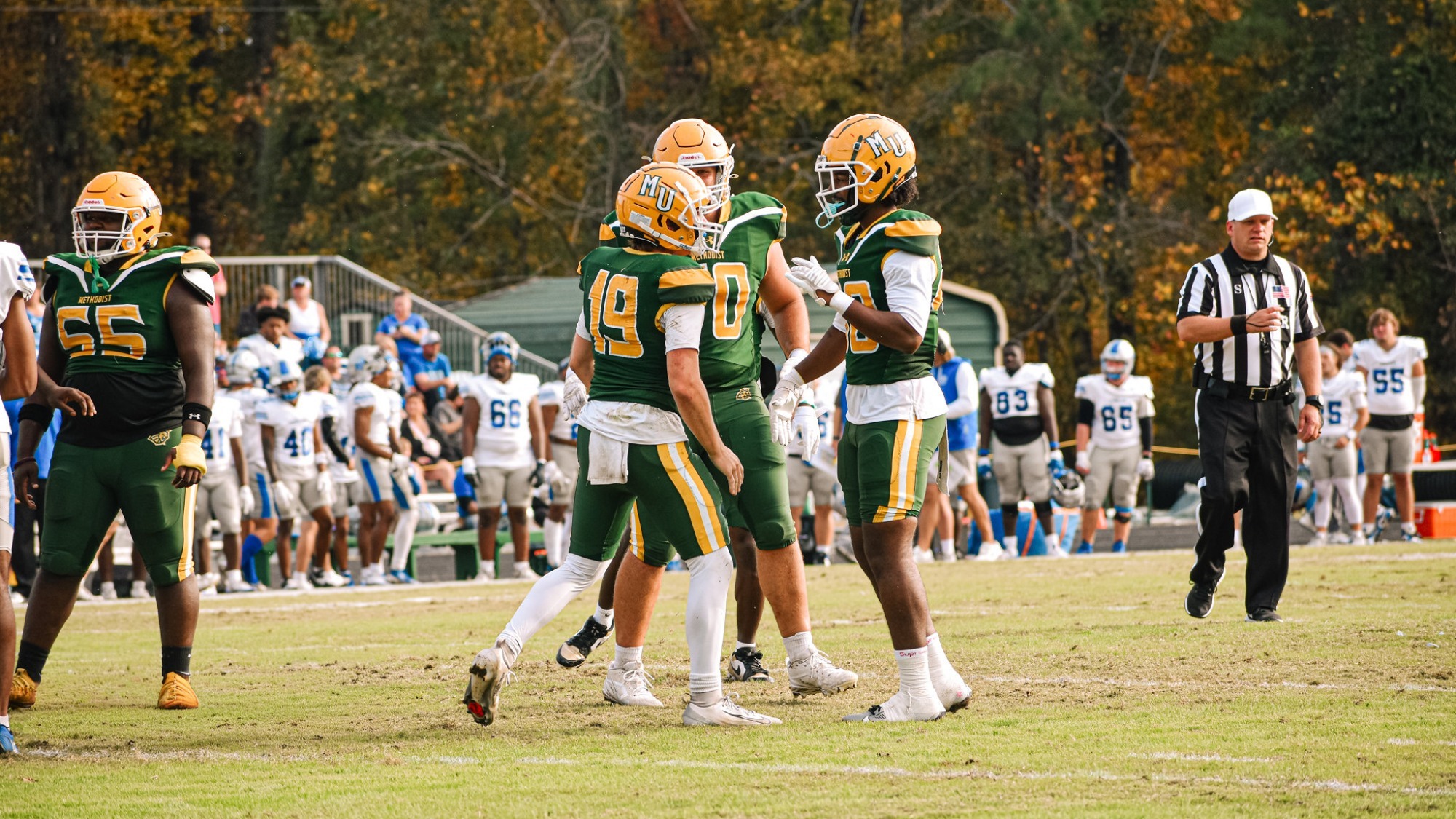 Asa Windham celebrating with teammates after his touchdown