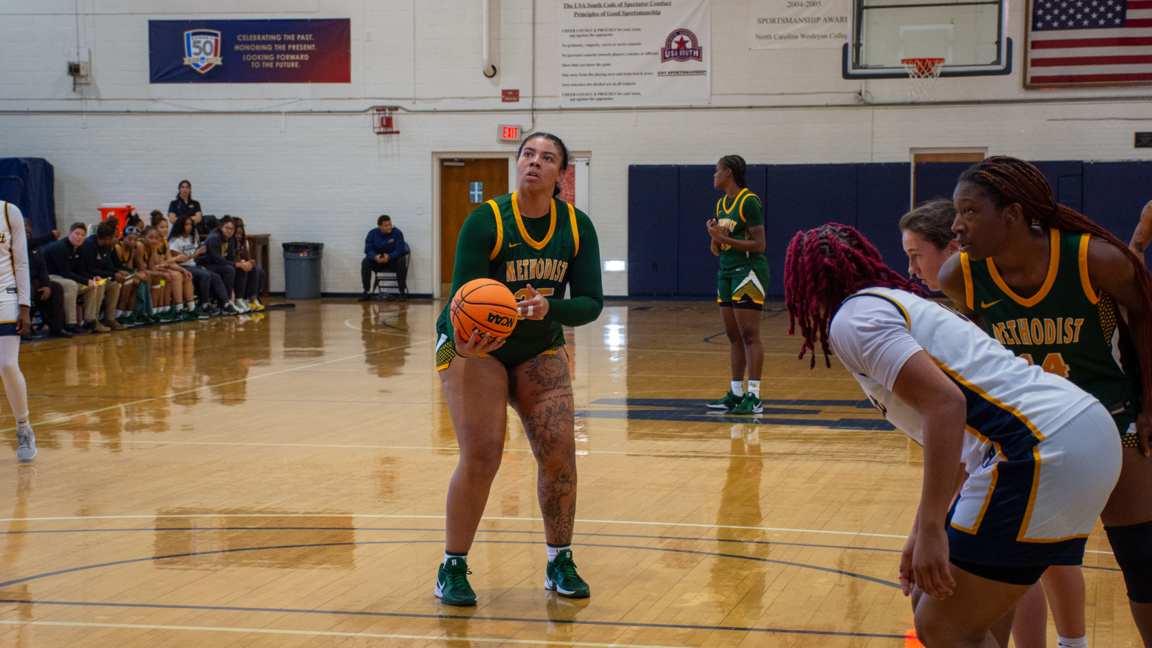 Eva McRae free throw in green jersey