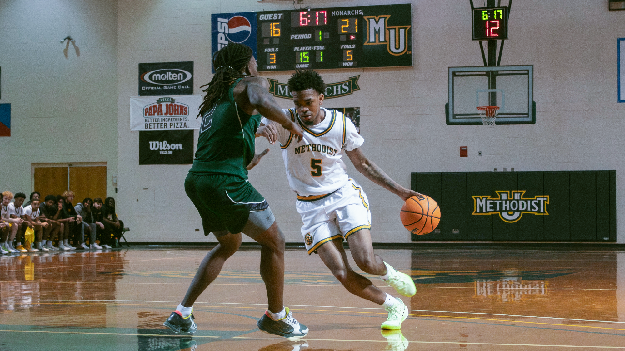 KJ Brooks driving vs William Peace defender