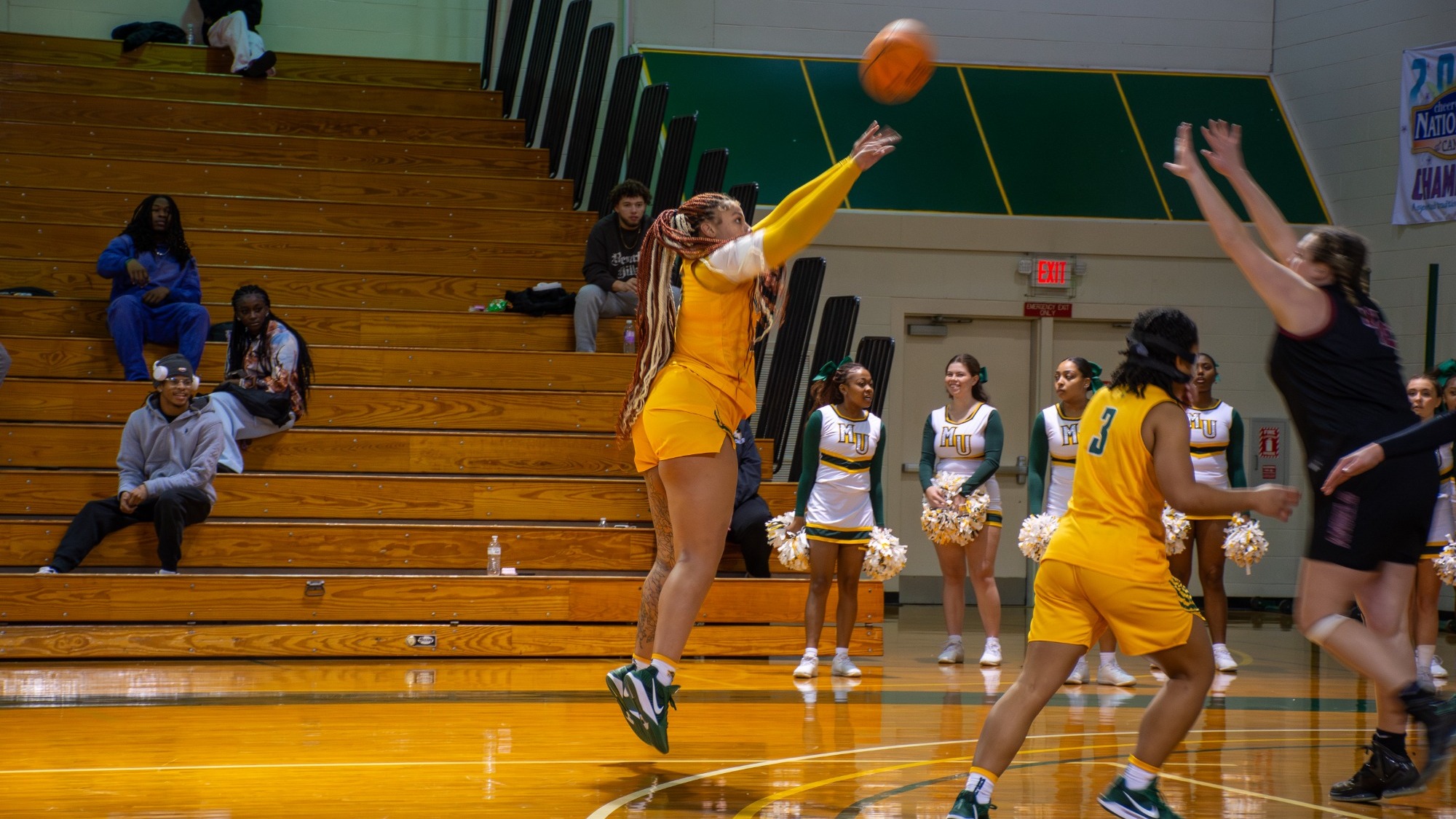 Eva McRae shooting a three at home against Meredith
