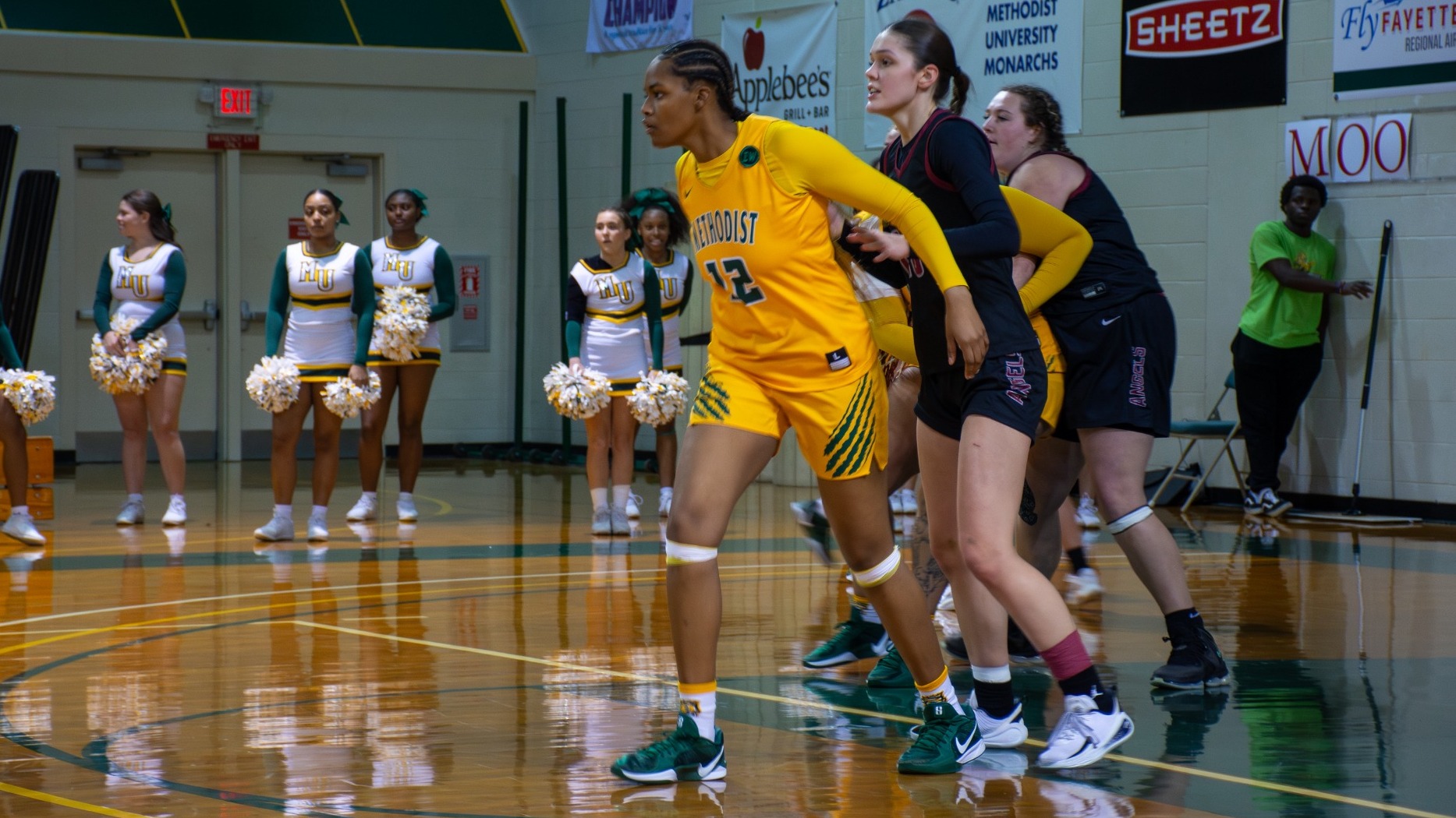 Jehari Jacobs getting ready to set a screen at home against Meredith College