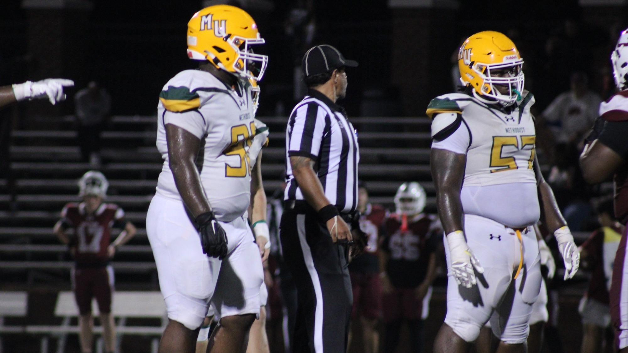 Kaleb Nelson and another defensive lineman