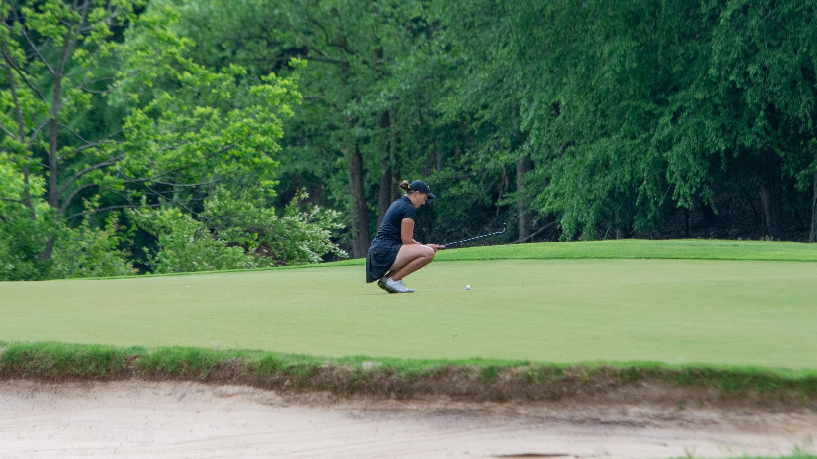Megan Kestner lining up putt