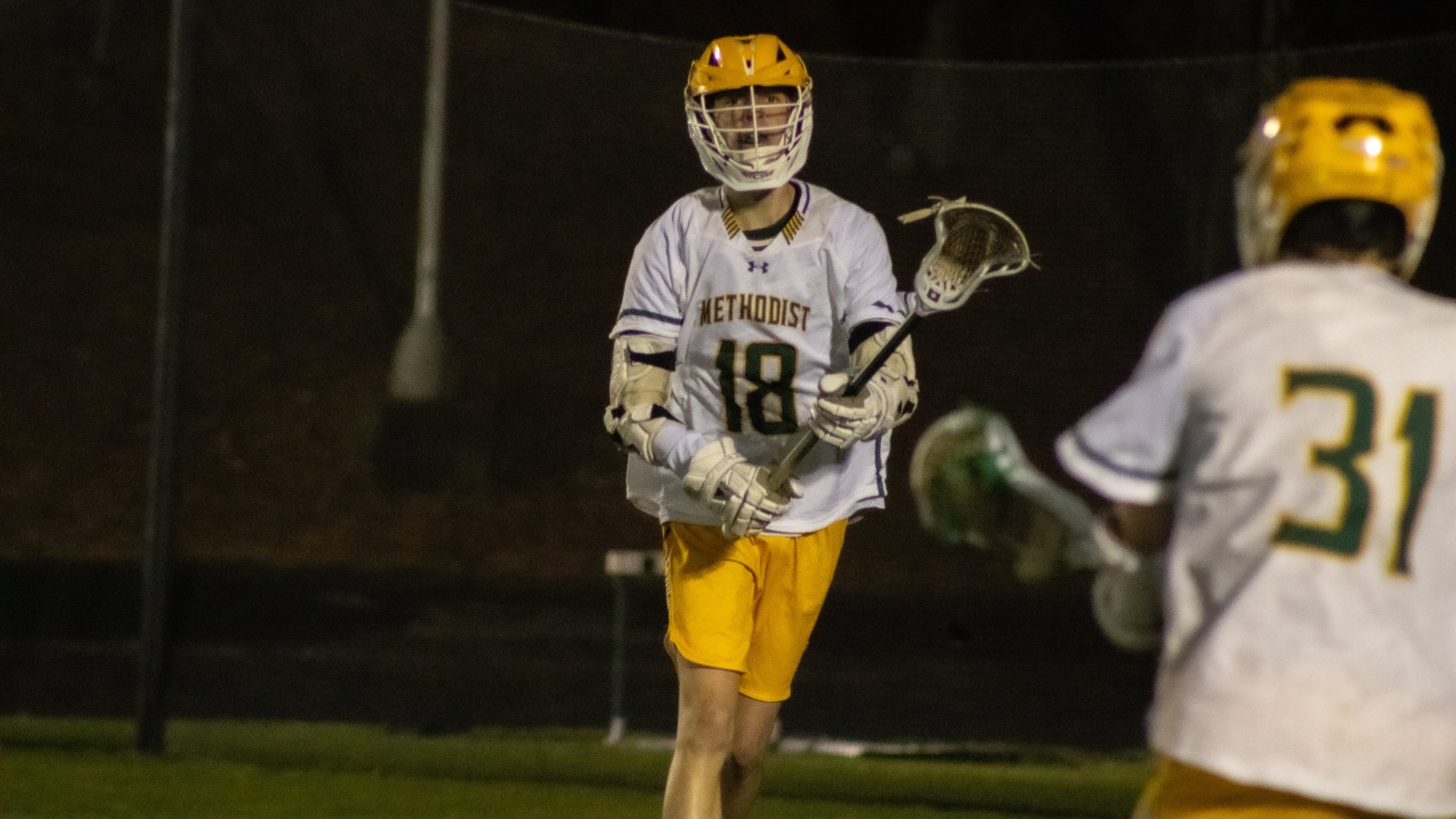 Marcus Myers passing the ball at home against Southwestern