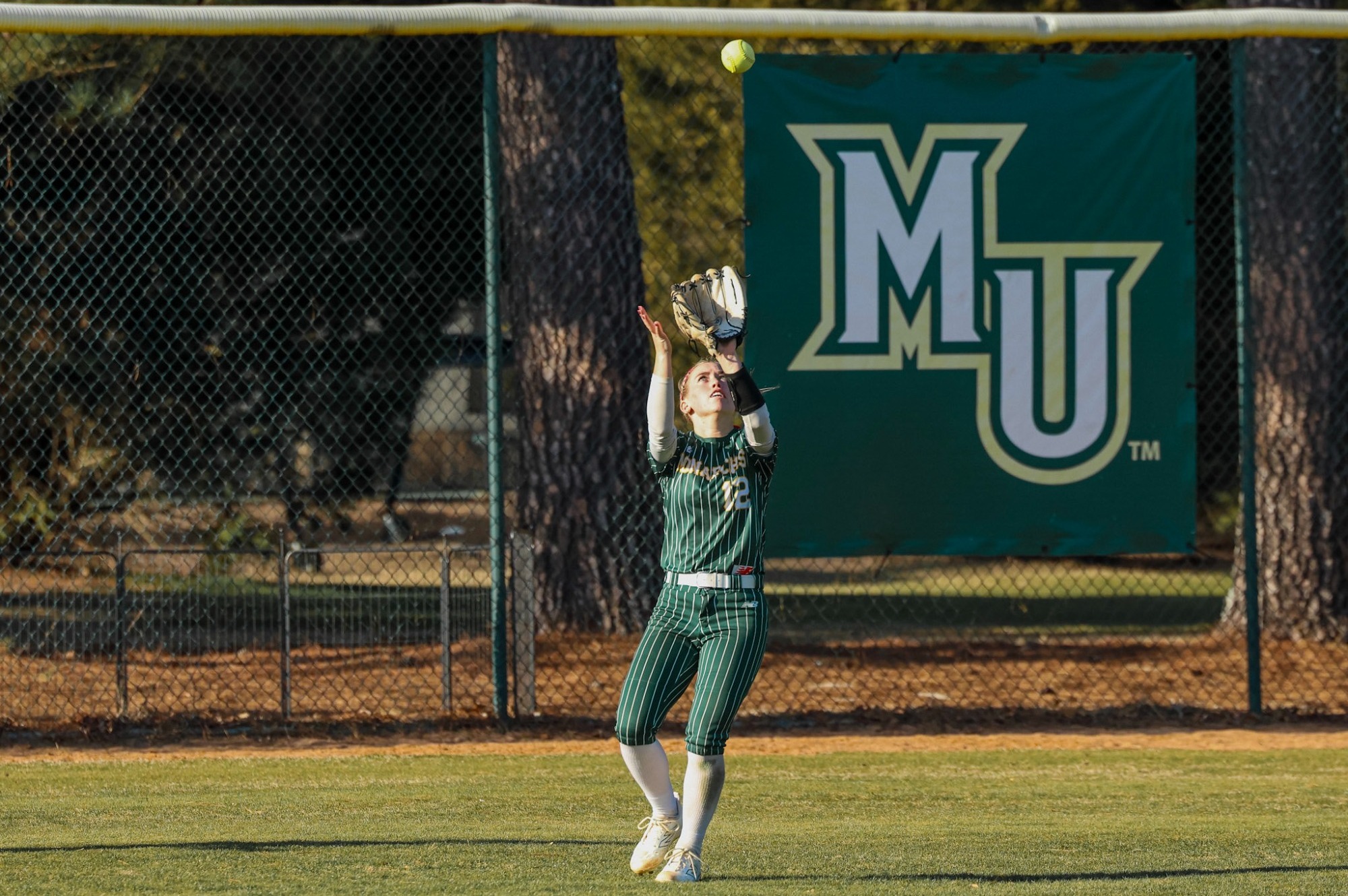 Hannah Lovick catching a fly ball in center field