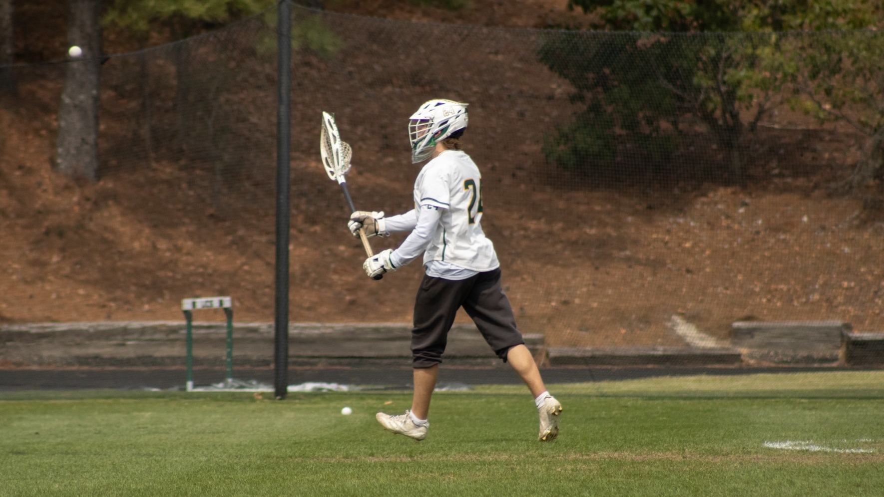 Cole Rigsbee moving the ball up the field against Bethany College