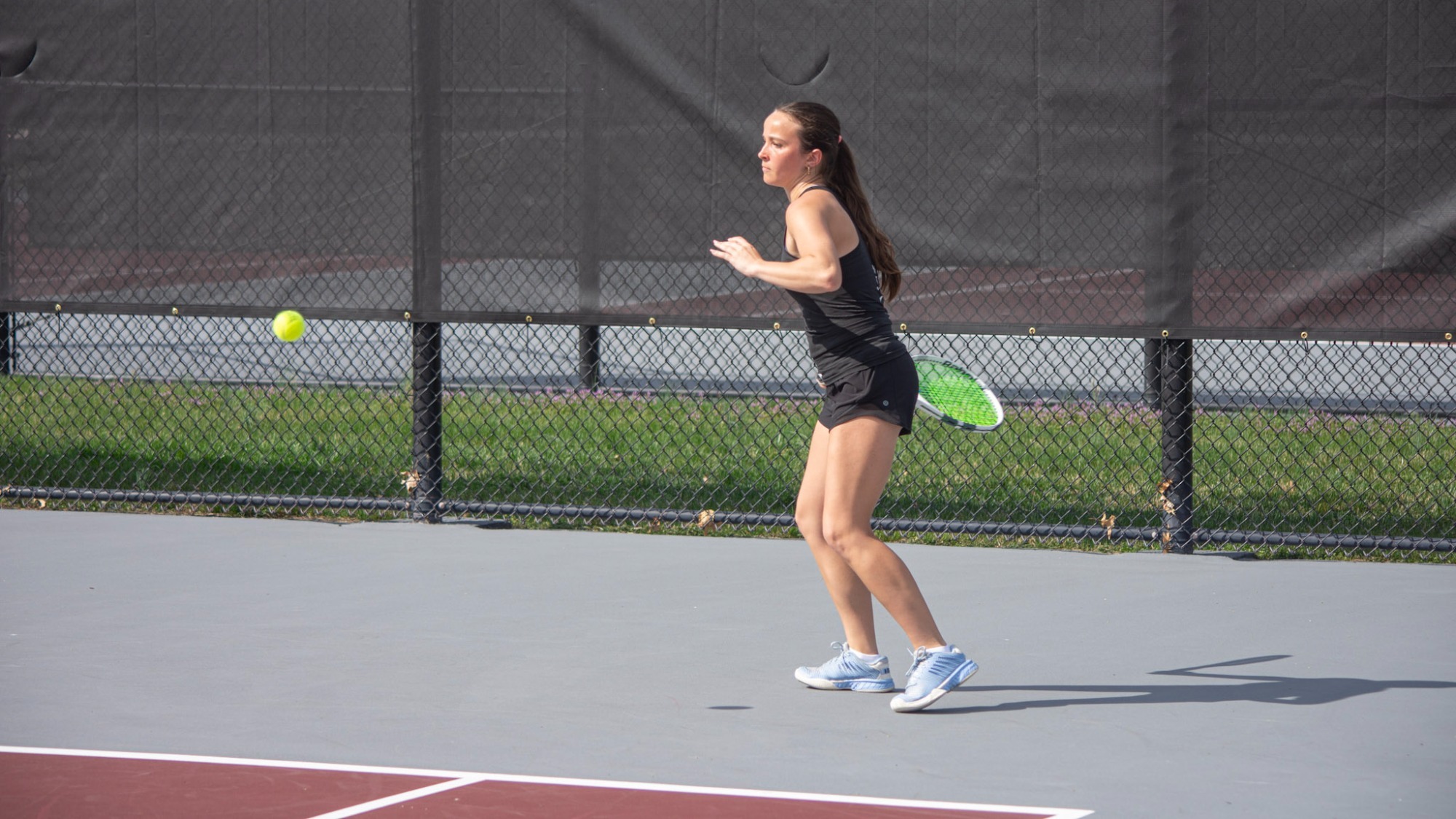 Shea Bieniek ready to return serve during doubles play at Roanoke