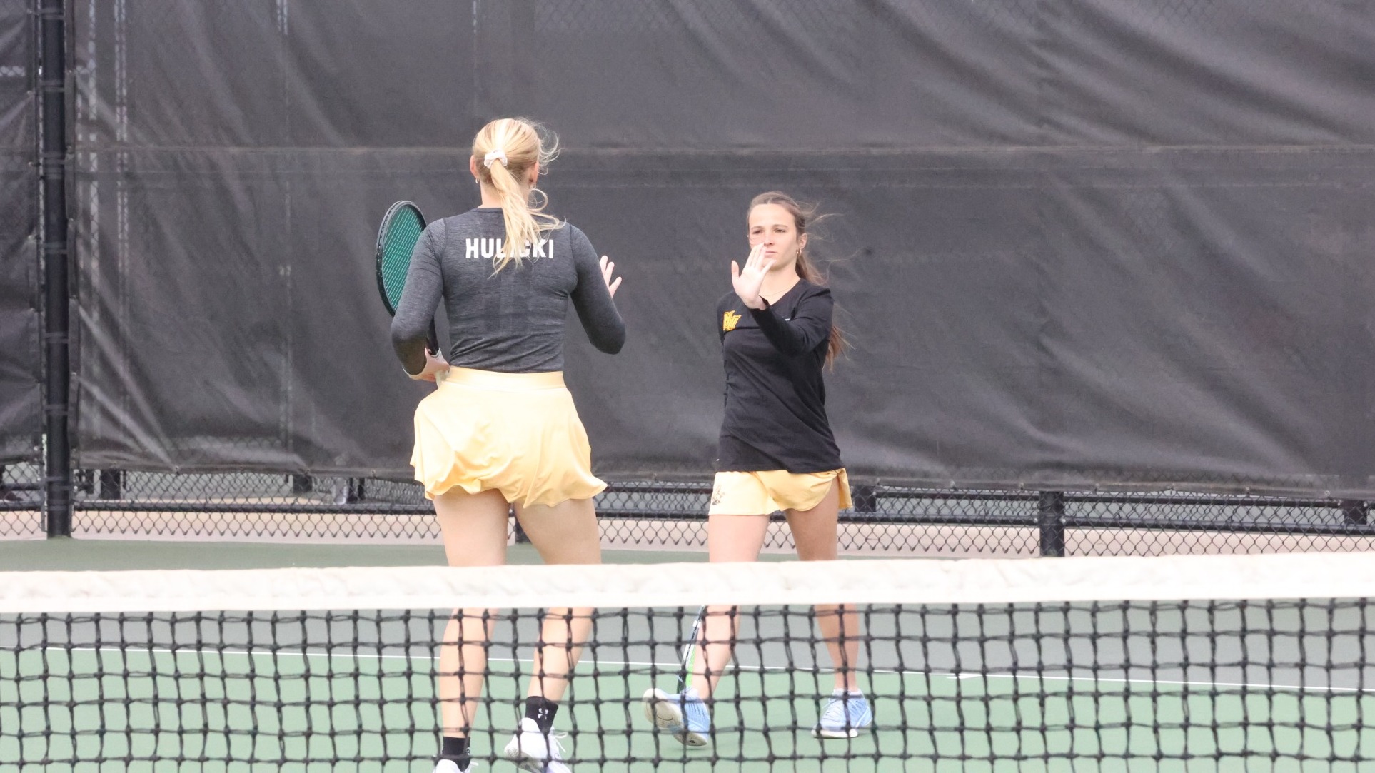 Emma Hulicki high fiving