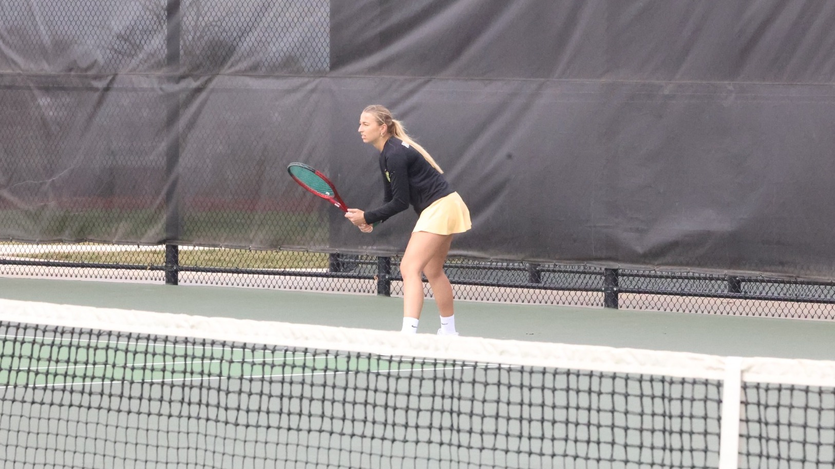 Helen Hofmann playing doubles at York College