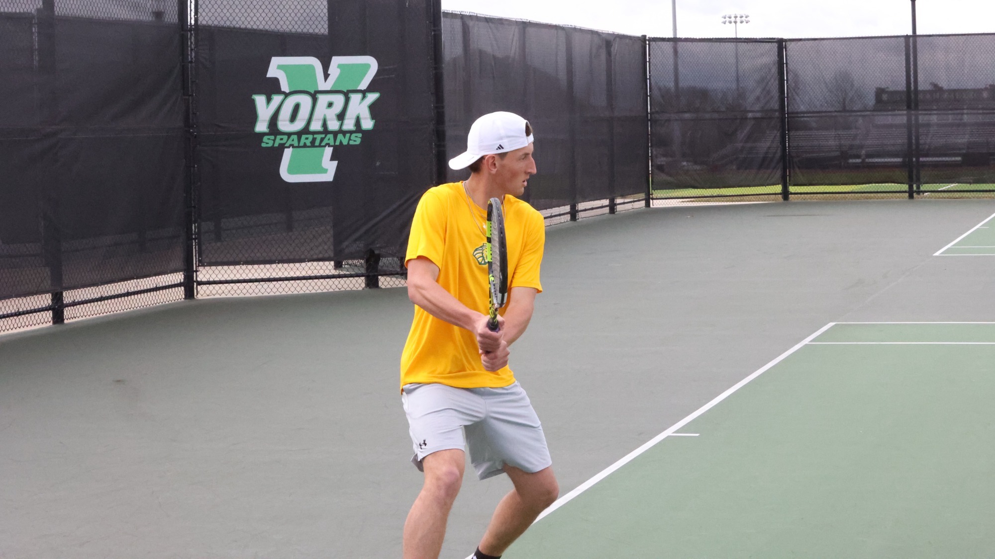 Aaron Zoubek playing doubles at York College