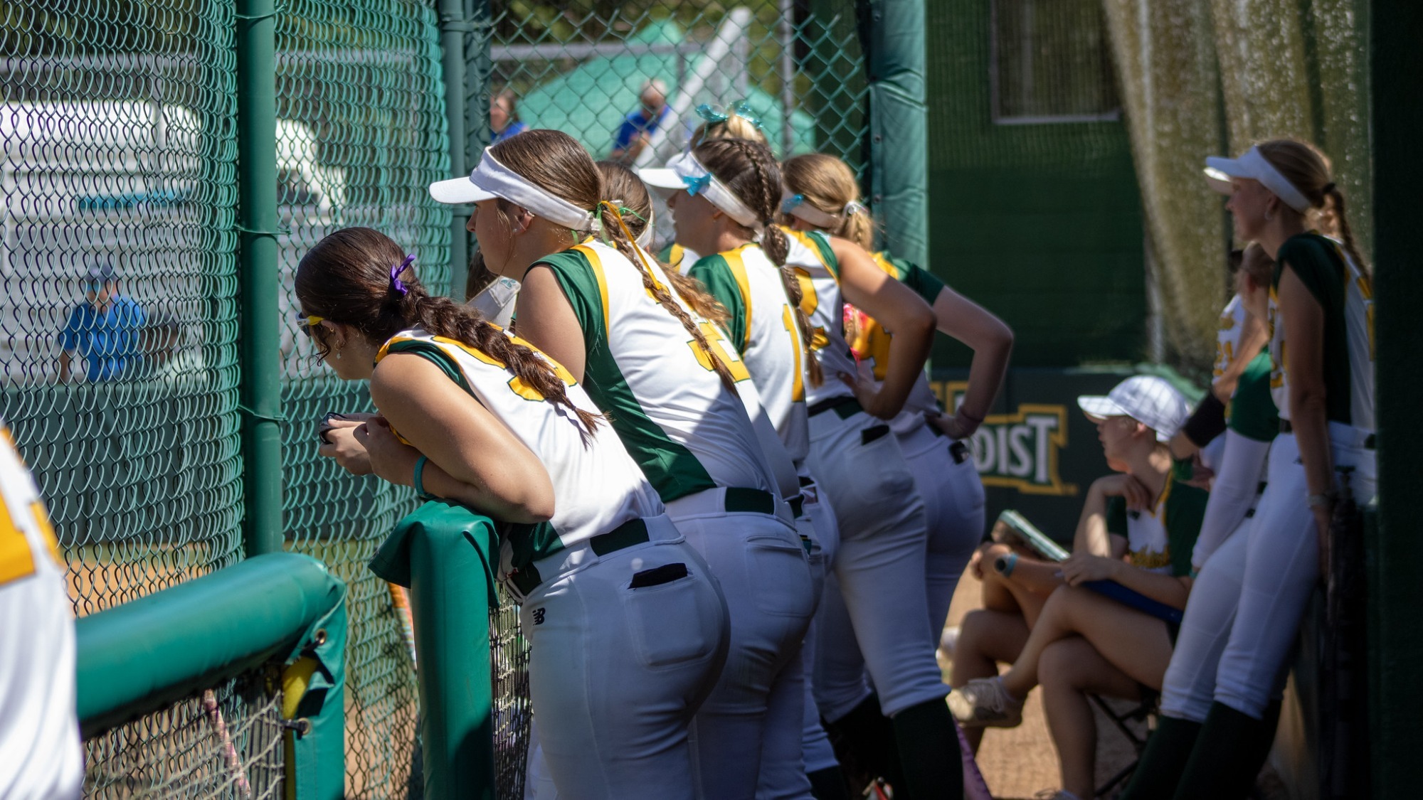 Softball team in the dugout against Brevard