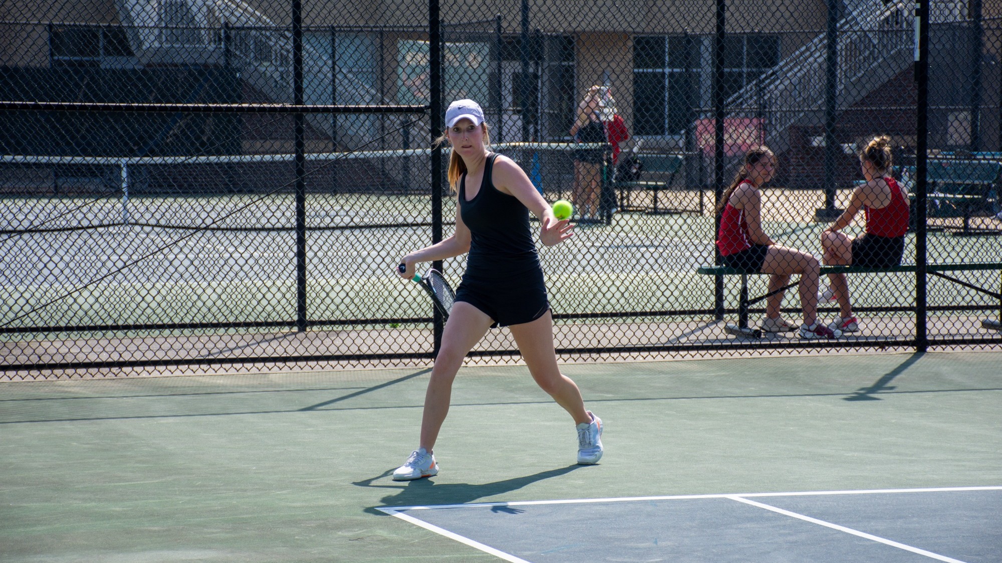 Caitlin Tihanovich getting ready to return the serve