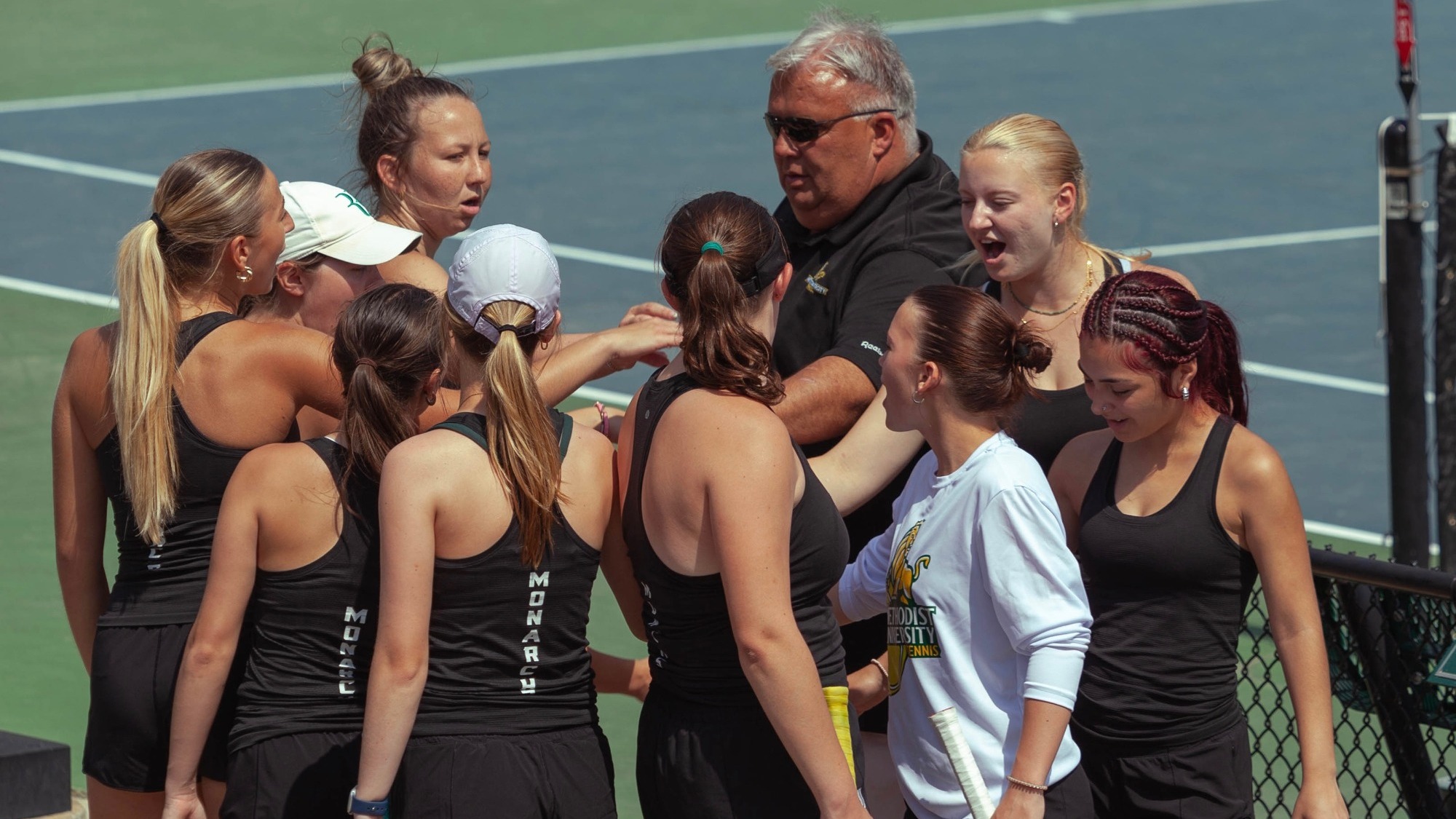 Handback leading a women's tennis team huddle