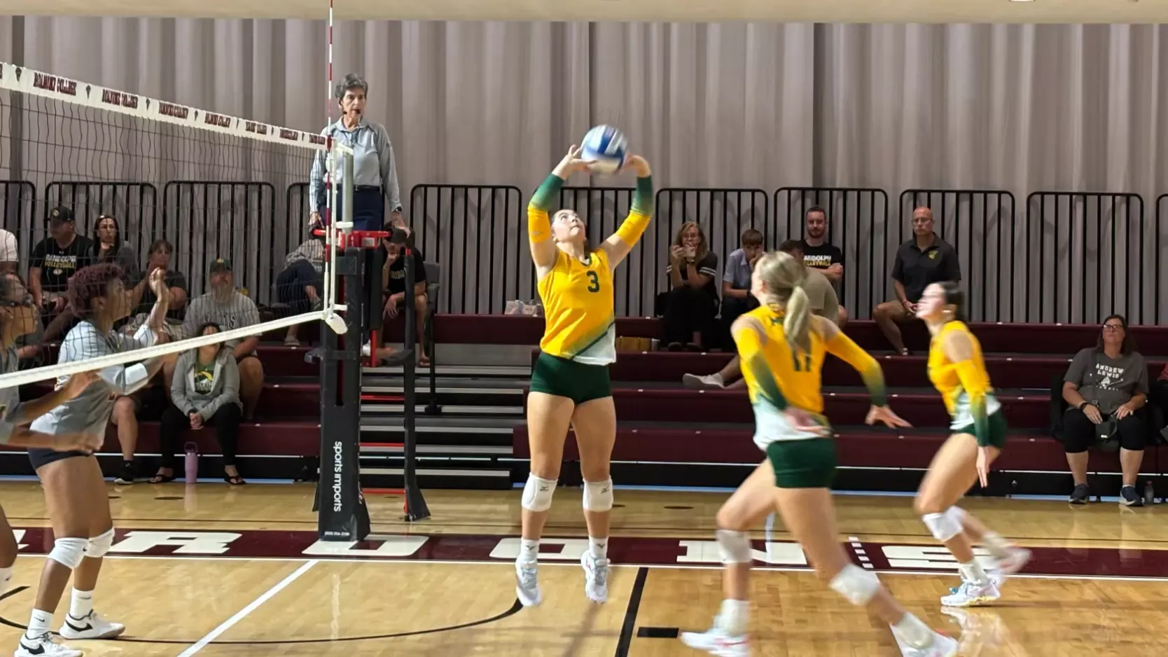 Harper Evans setting the ball for Grace Tillery