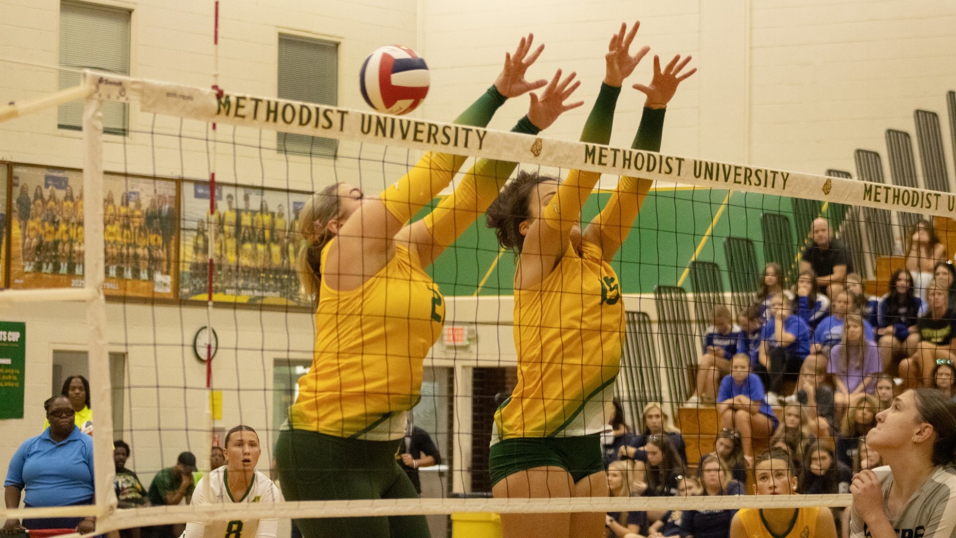 Kassidy Edge and Savannah Hovander going up for a block