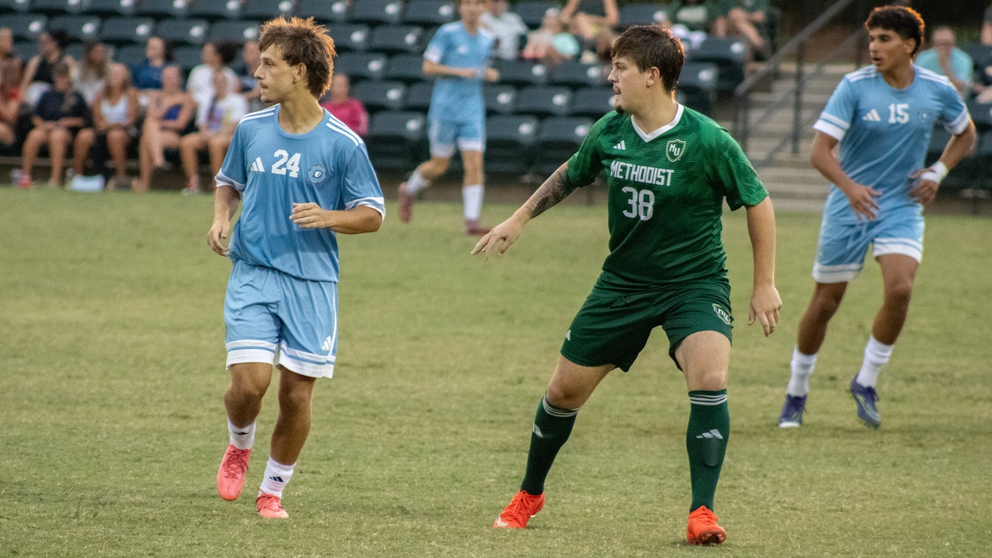 Aiden Gummer next to an opposing player in the scrimmage