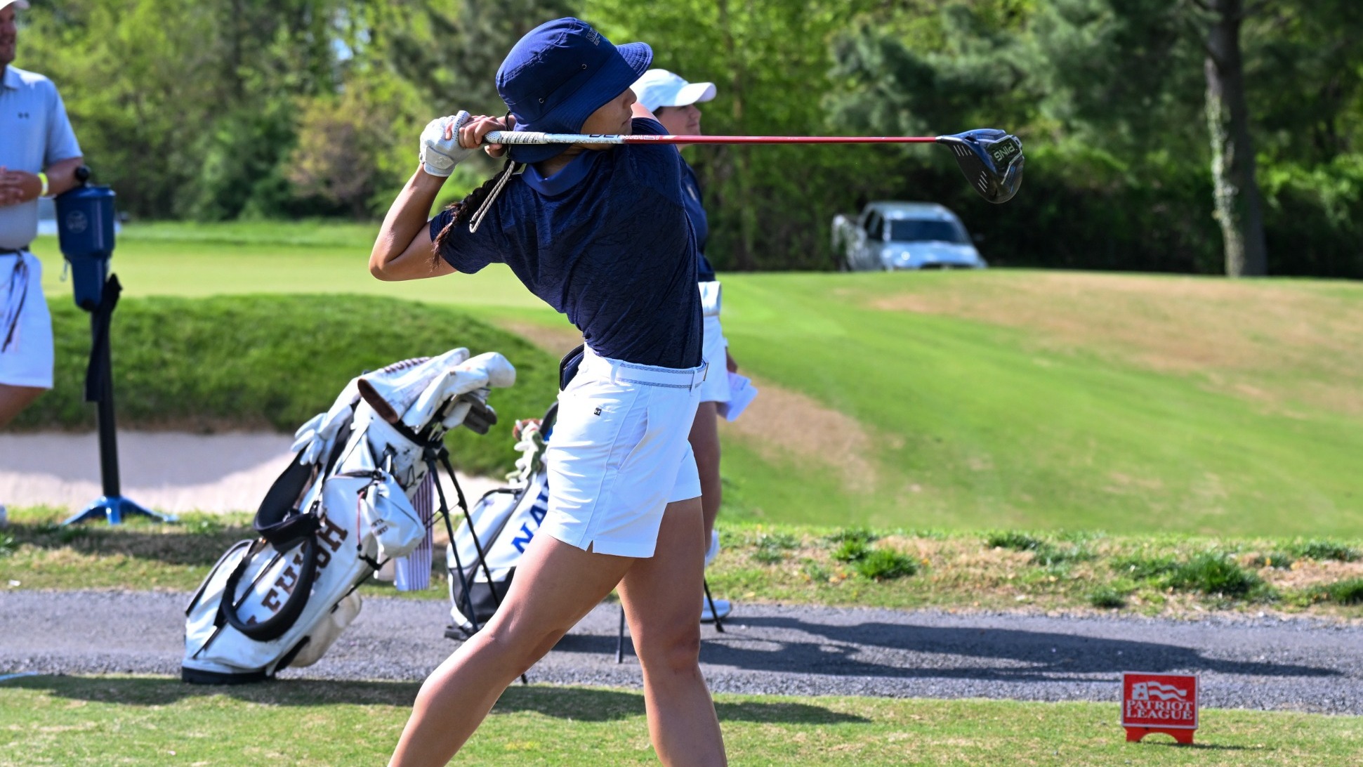Navy junior golfer Keira Howard tees off the first hole in the Patriot League Championship's first round at the U.S. Naval Academy Golf Club on April 17, 2026