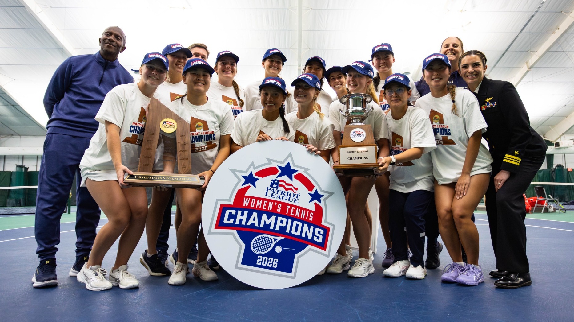 Navy celebrates beating Boston University and claiming the 2026 Patriot League Women's Tennis Championship on April 19, 2026