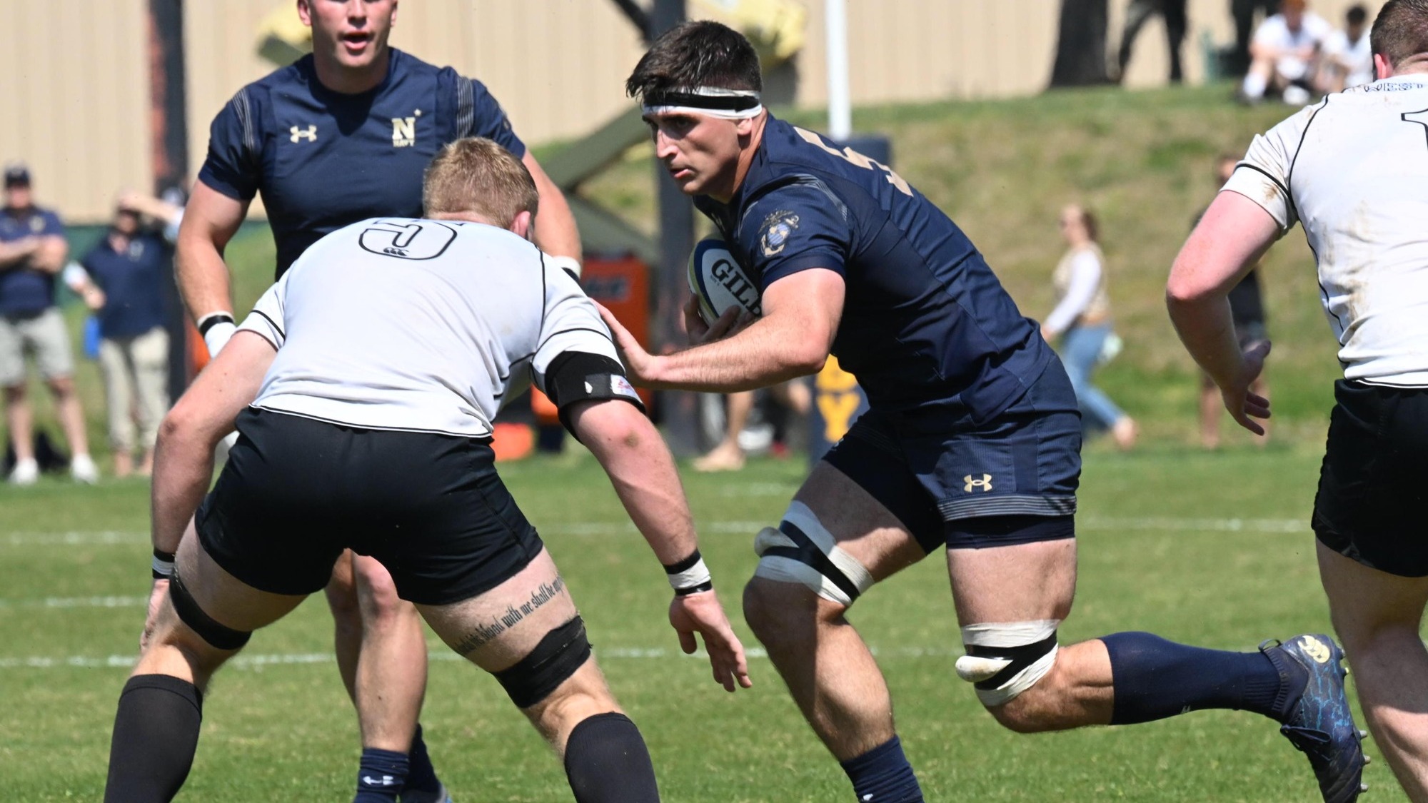 Hutch Coward bracing Army defender in CRAA Quarterfinal Game on 4.18.26