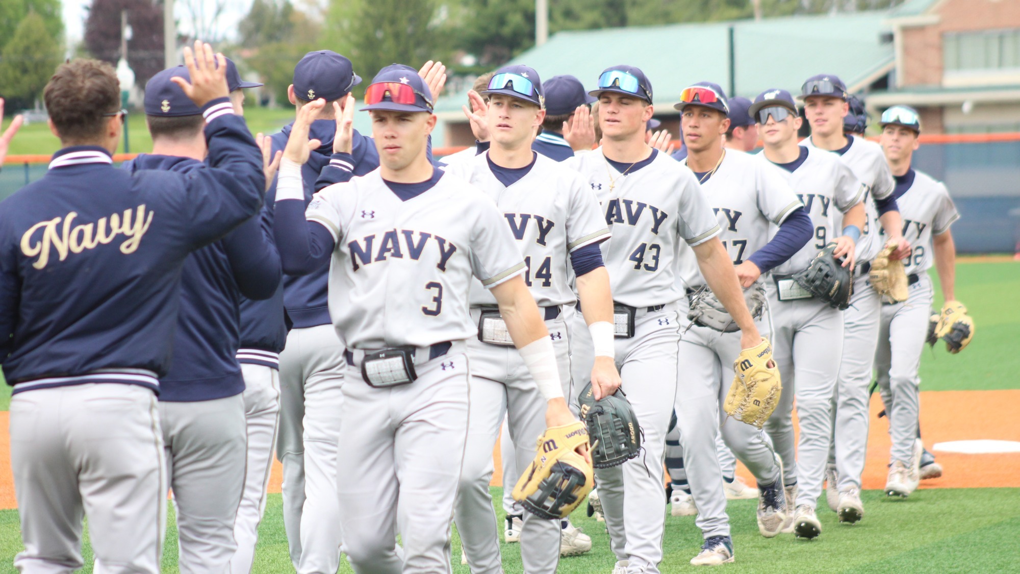 Navy baseball in its handshake line following the game-one win over Bucknell on April 26, 2026 in Lewisburg, Pa.