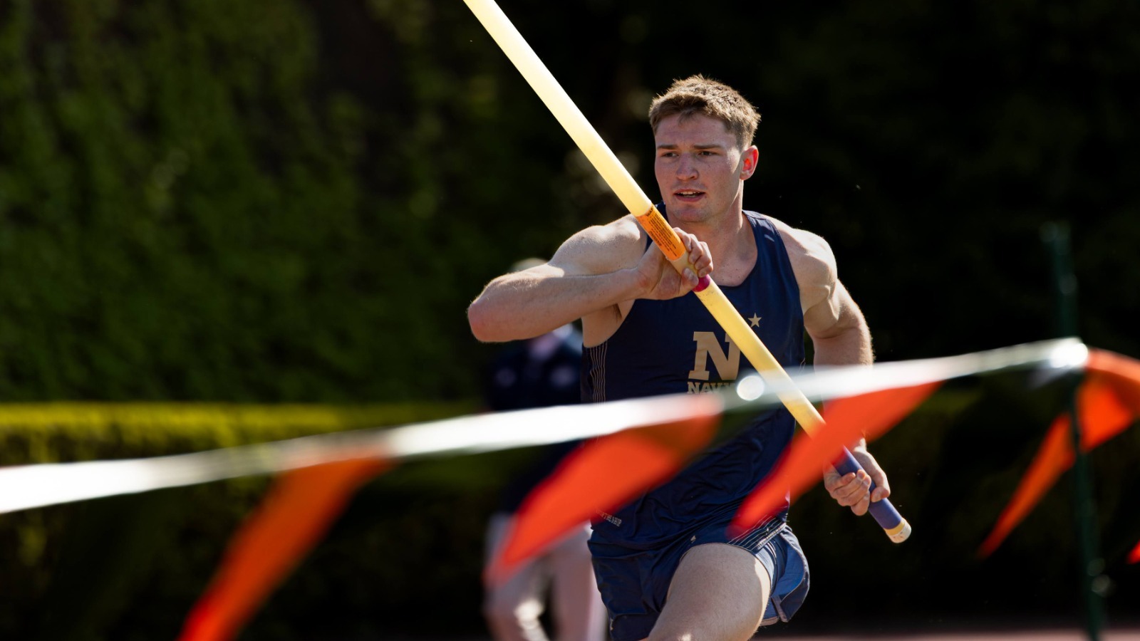 Adam Bell Running with the Pole Vault