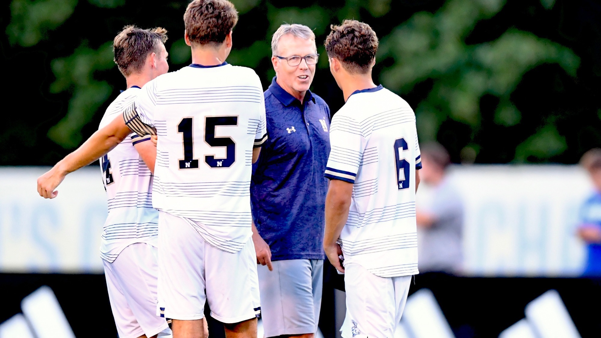 Navy men's soccer head coach John Hackworth talking to his players at Delaware on August 11, 2026