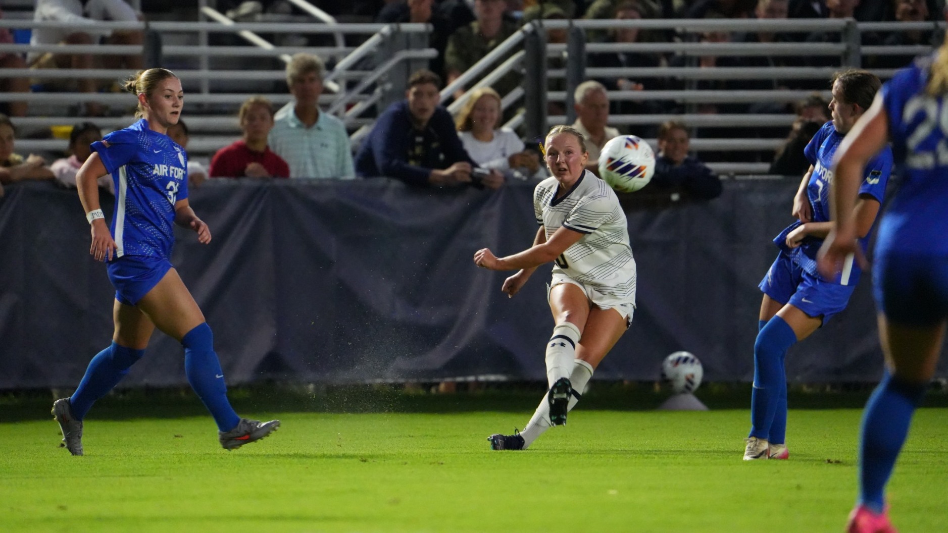 Sophia Ryan lofts a cross in Navy's match versus Air Force on Aug. 20