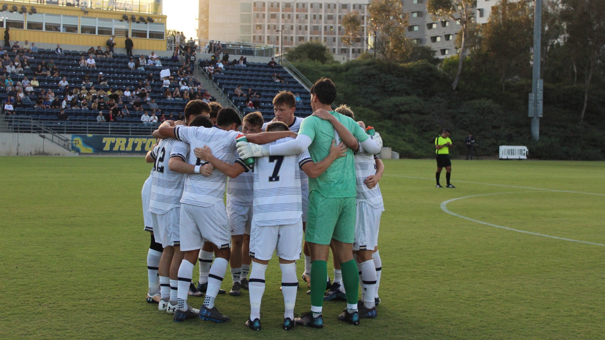 The Navy men's soccer team's starters huddle together at UC San Diego on August 20, 2026 in La Jolla, Calif.