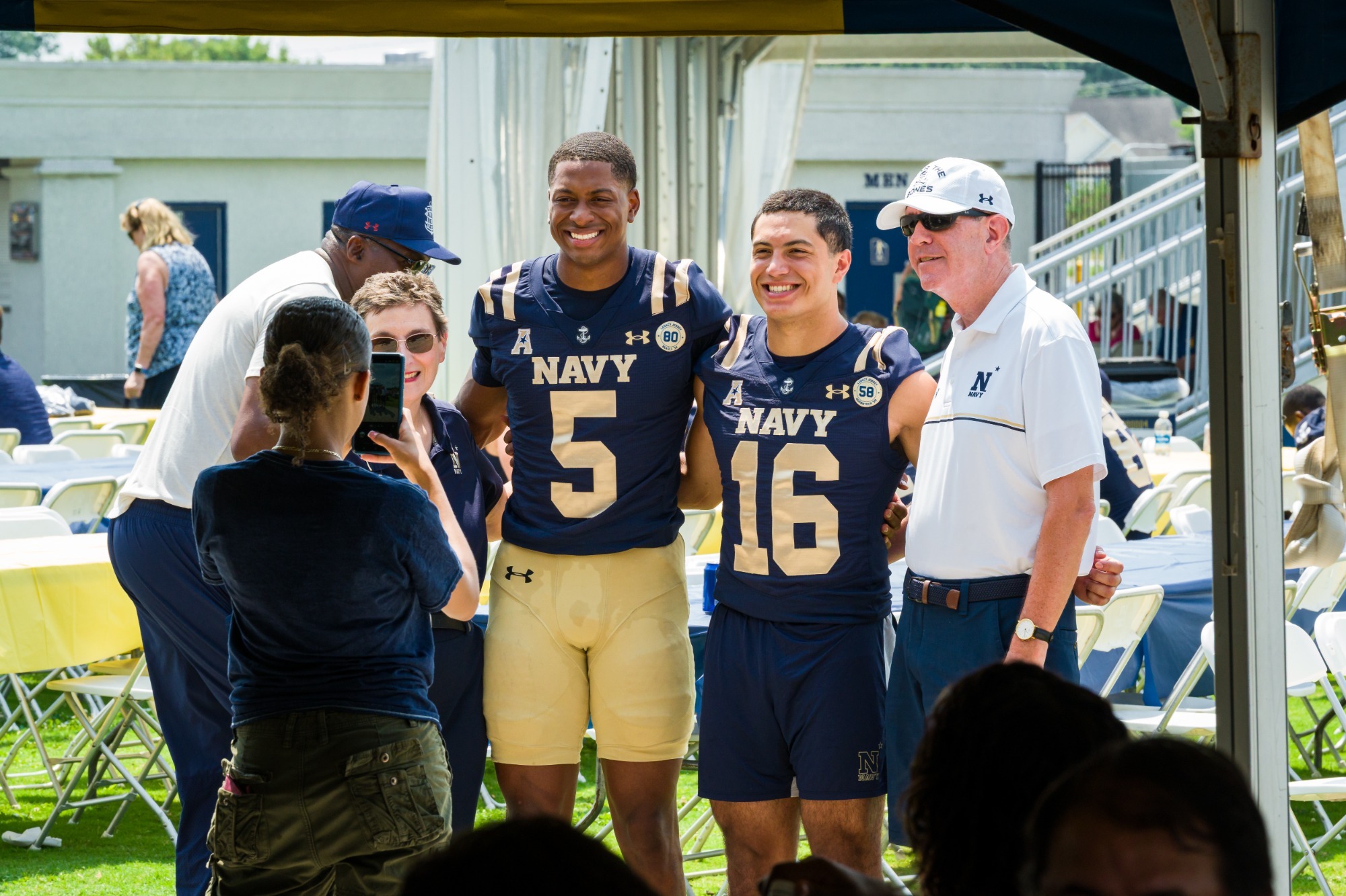 Giuseppe Sessi and Braxton Woodson meet with fans at the Blue-N*-Gold BBQ
