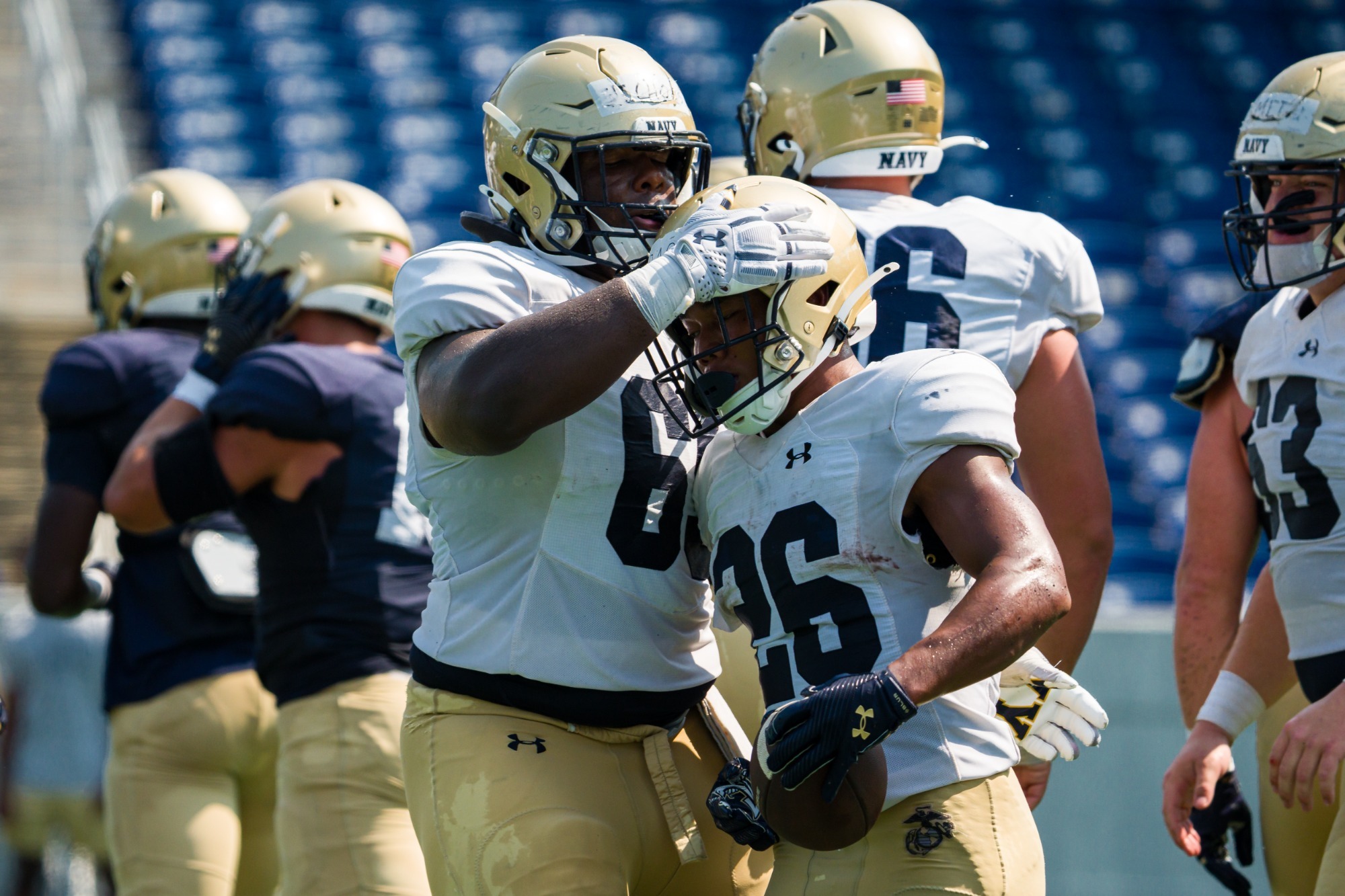 Michael Barrow and Cam Nichols celebrate a touchdown during a scrimmage at the stadium