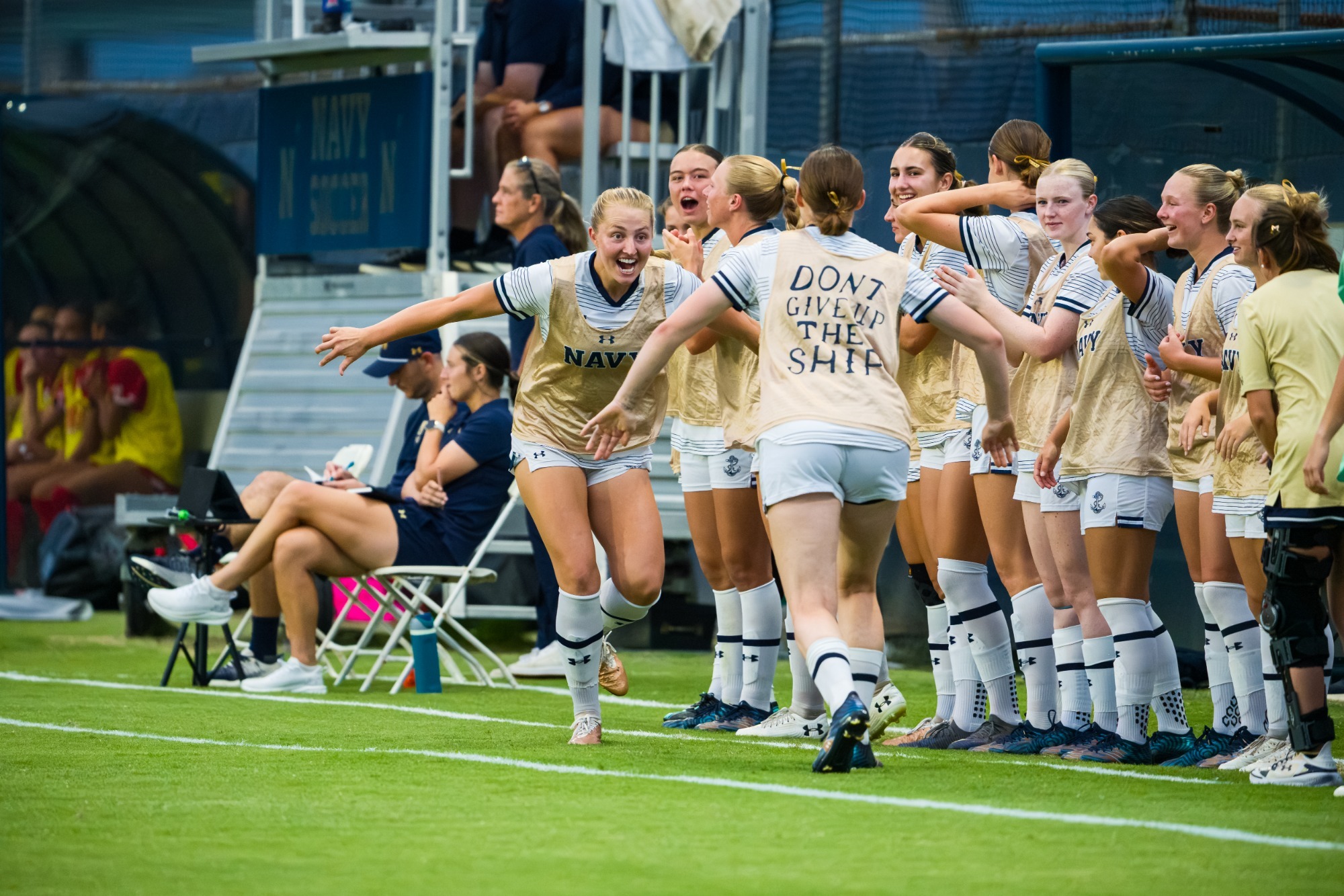Women's Soccer bench celebrates against Maryland