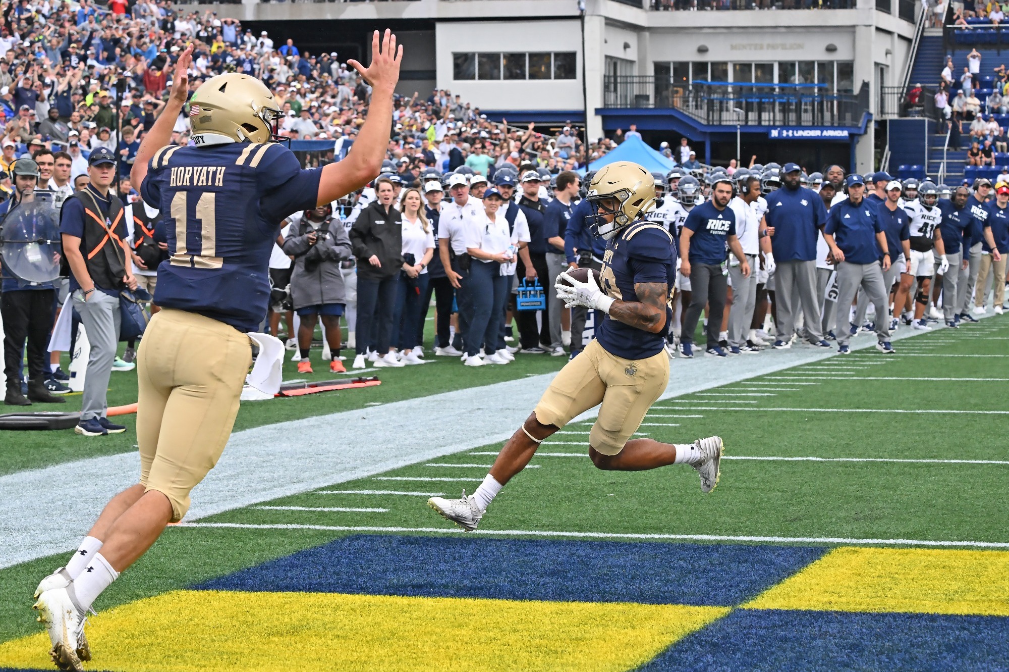 Luke Hutchison scores a touchdown as Blake Horvath celebrates
