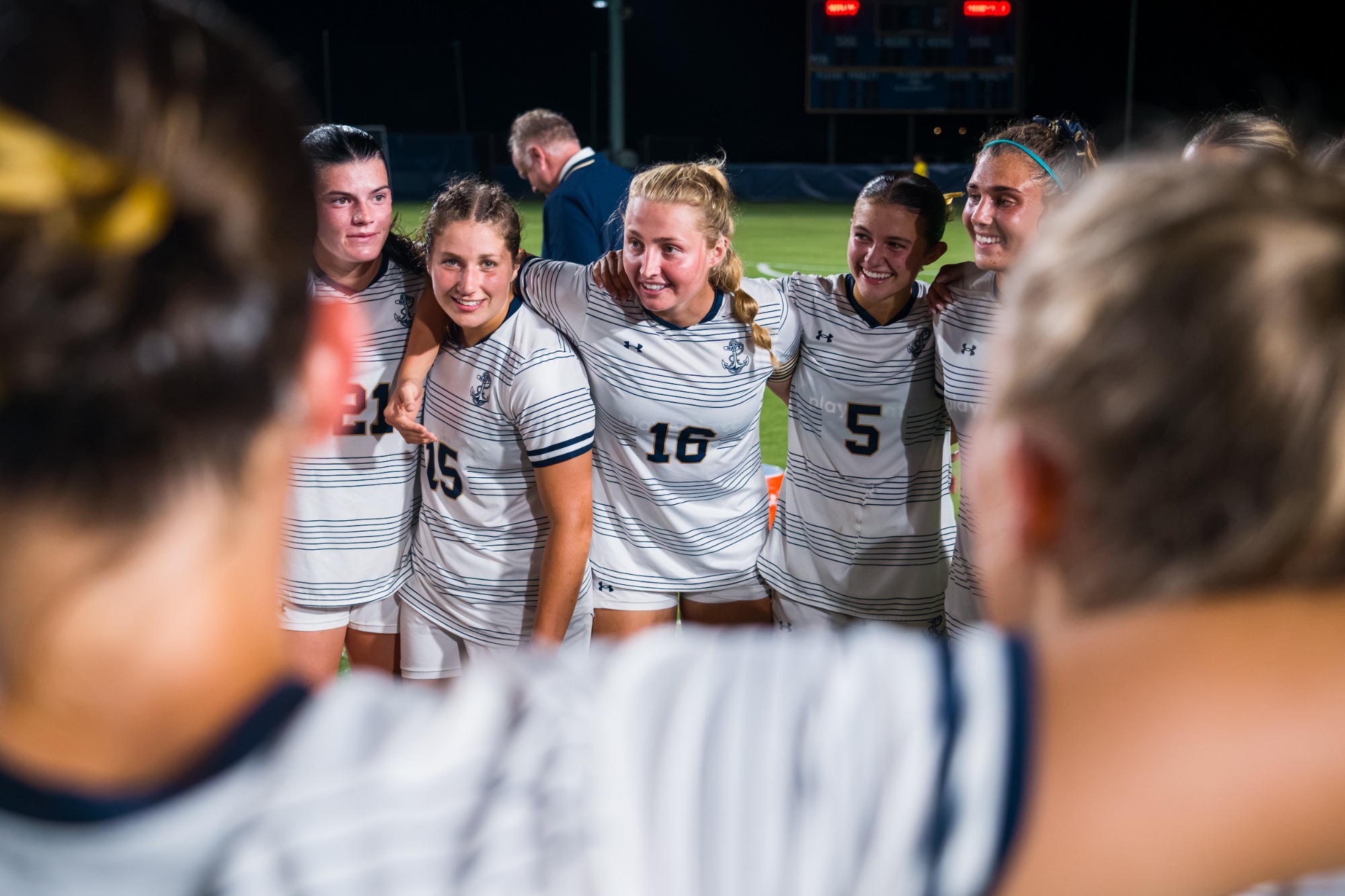 Navy women's soccer huddle