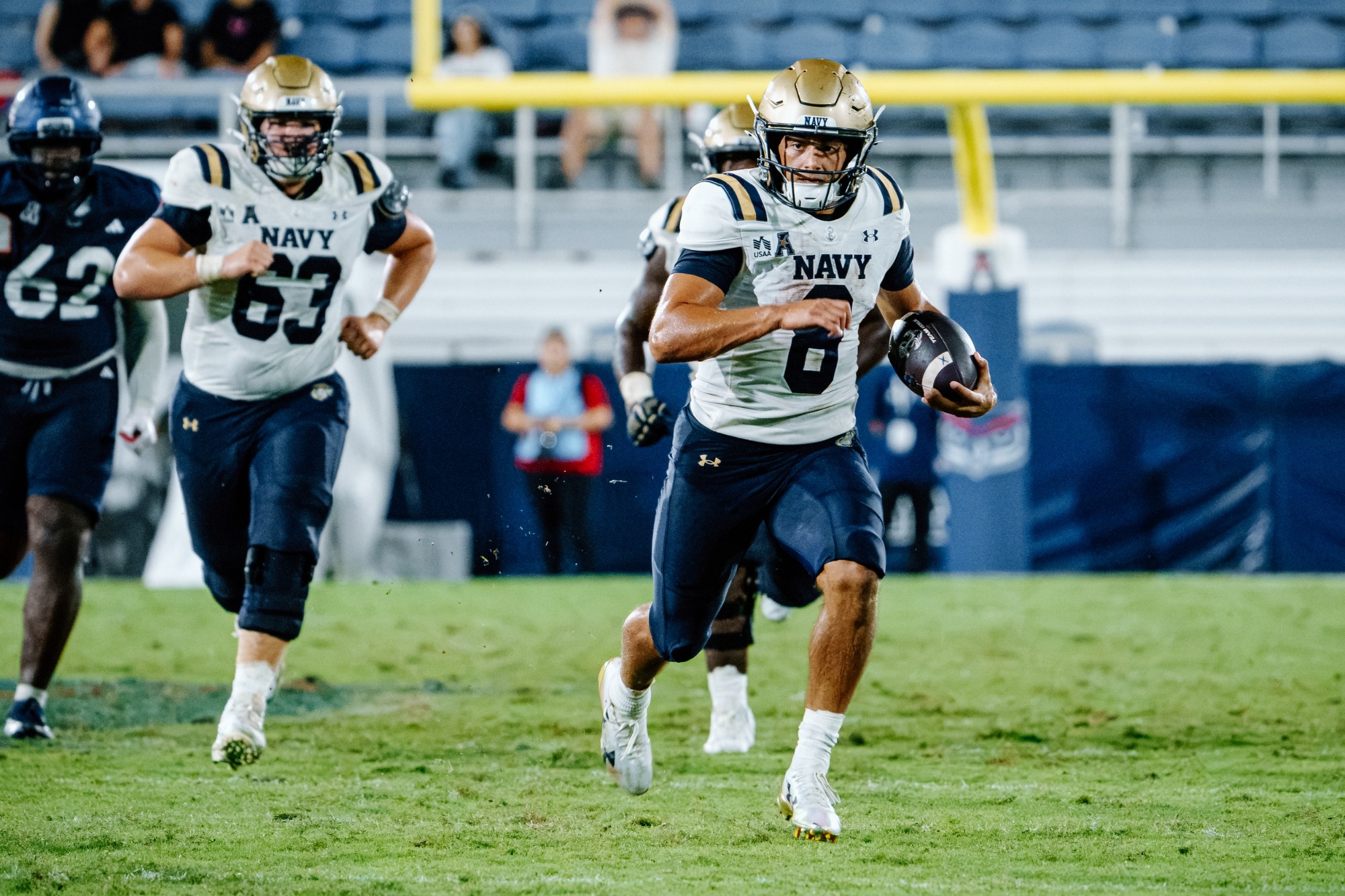 Navy quarterback Jackson Gutierrez runs for a touchdown against FAU