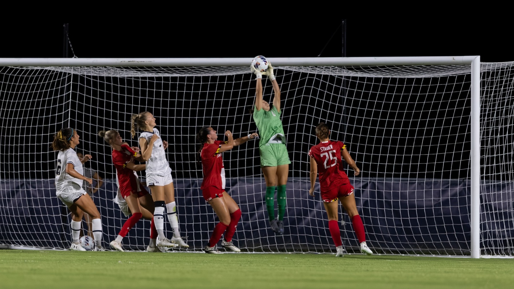 Natasha Stramrood makes a leaping save versus Maryland
