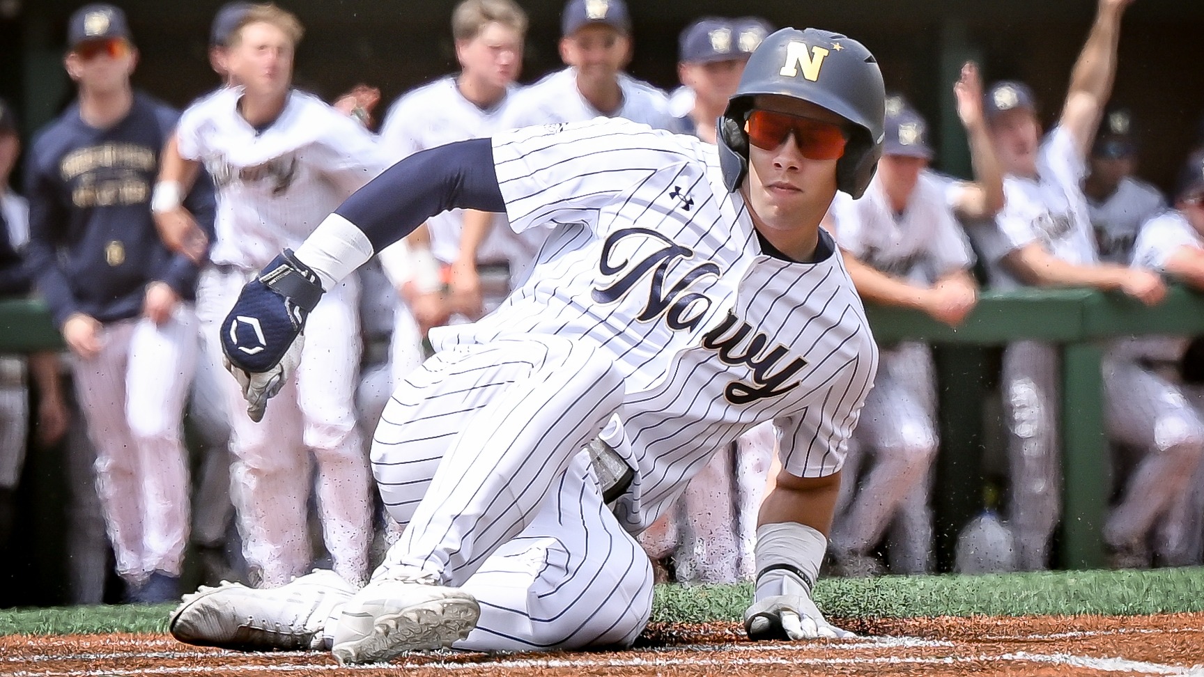 Navy junior outfielder Andrew Manning slides home against Army on May 2, 2026 in Annapolis, Md.